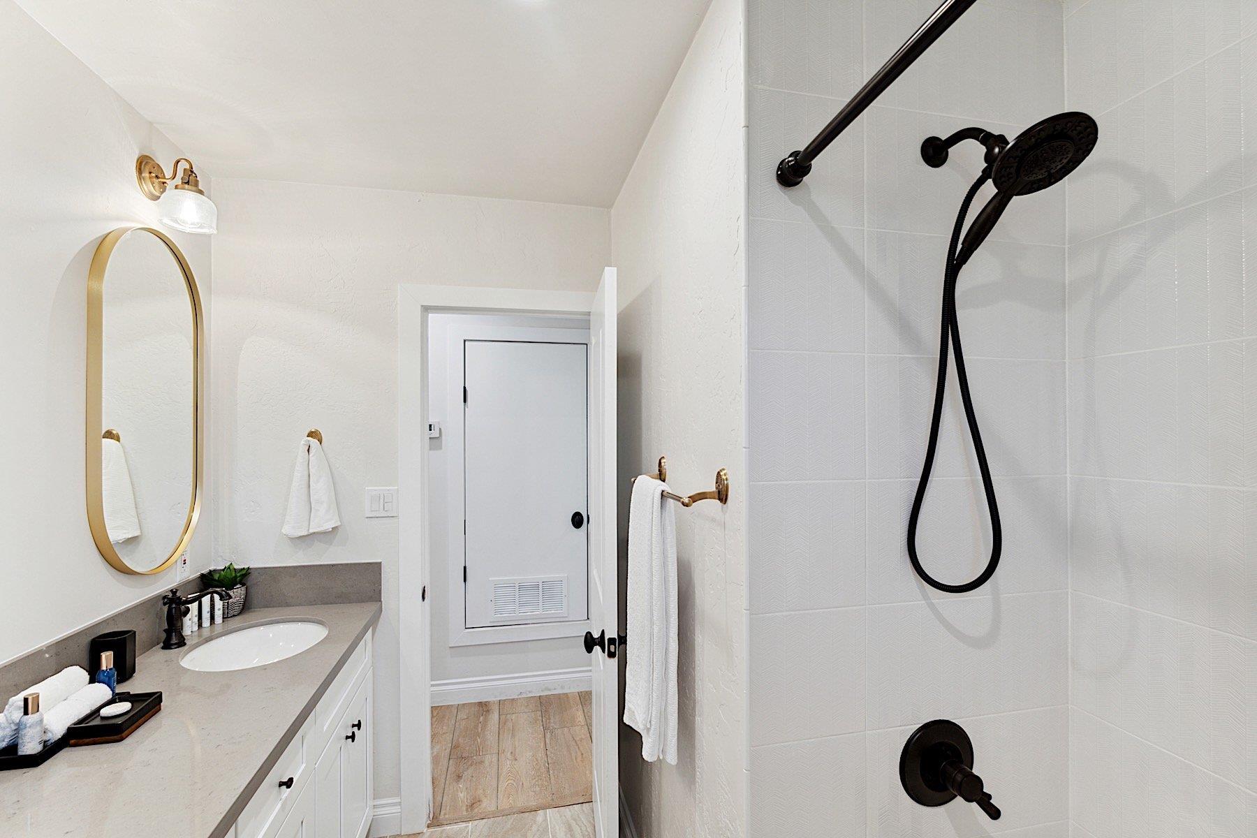 Second bathroom  Dual sinks and tub shower combo