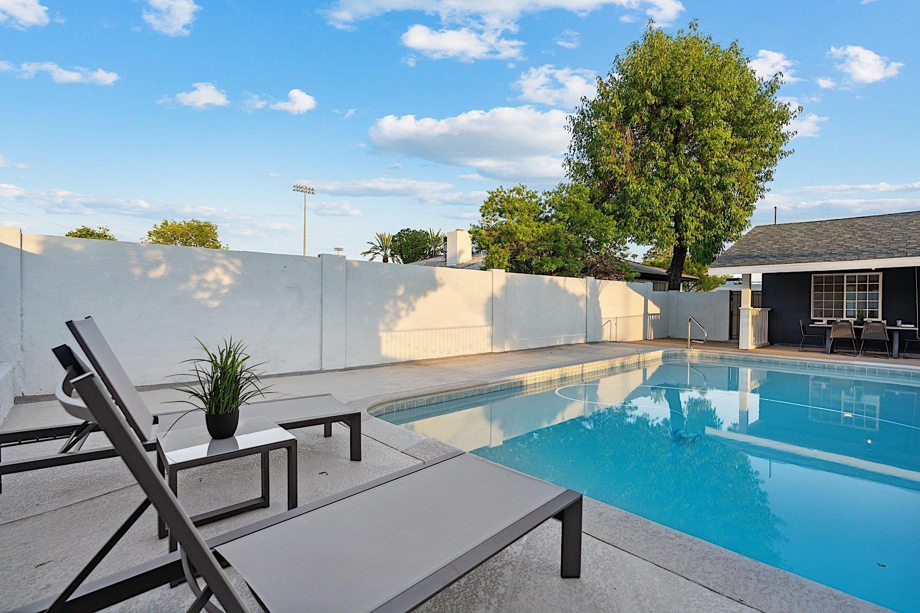 Sparkling pool and sun loungers