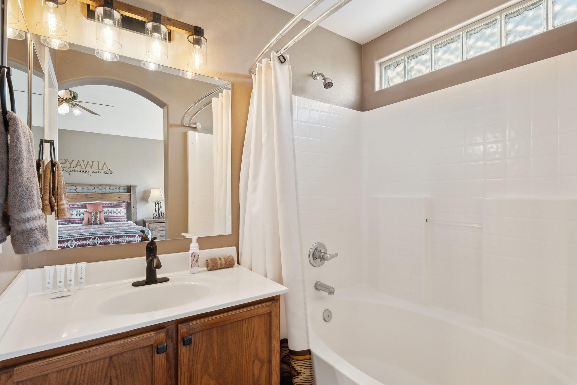 Primary Bath with TubShower Combo. Separate commode room not pictured.