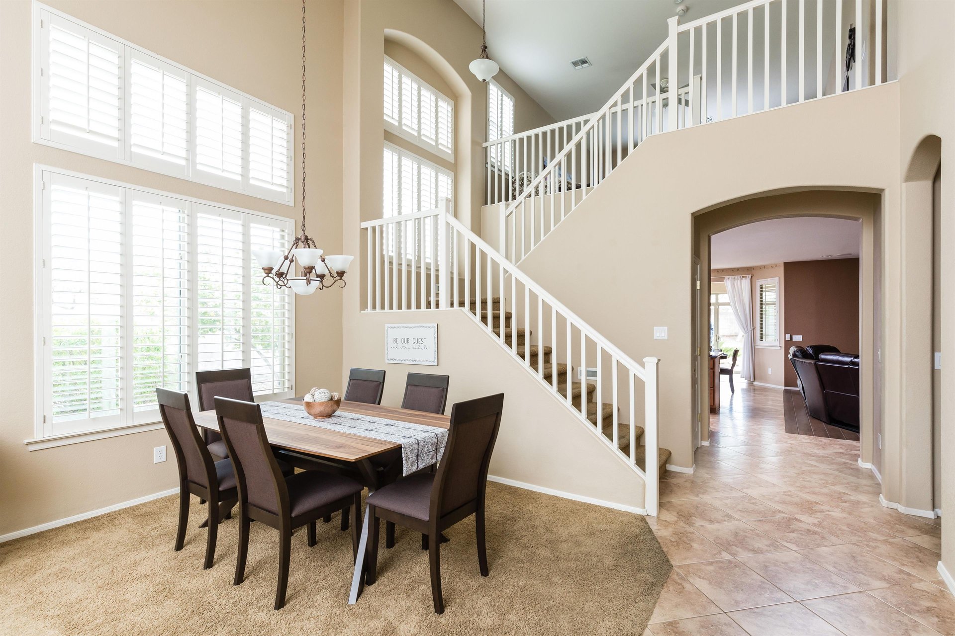 6 Chair dining table, with stairs leading up to the second floor