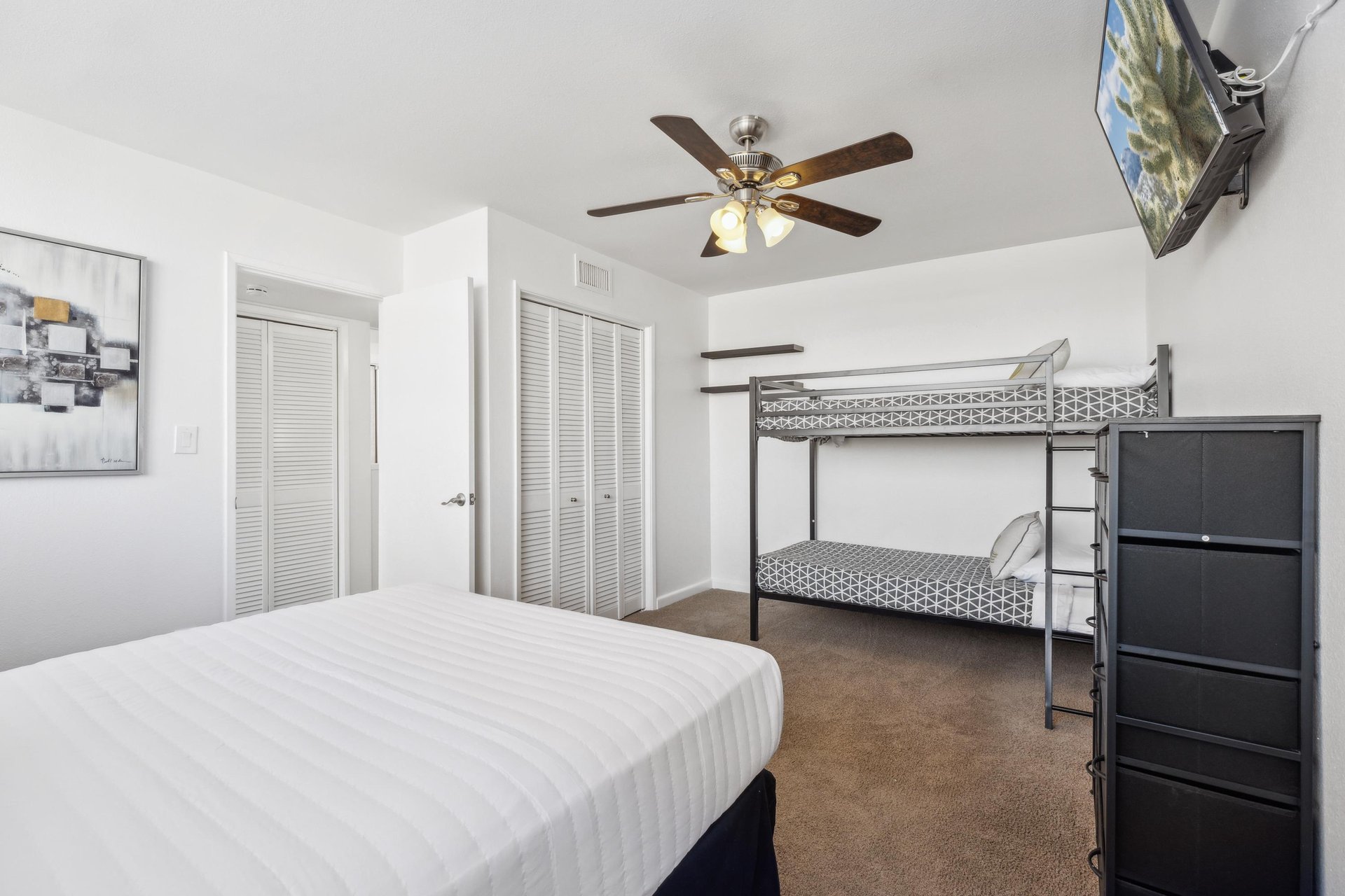 First guest bedroom equipped with 2 twins and a full sized bed