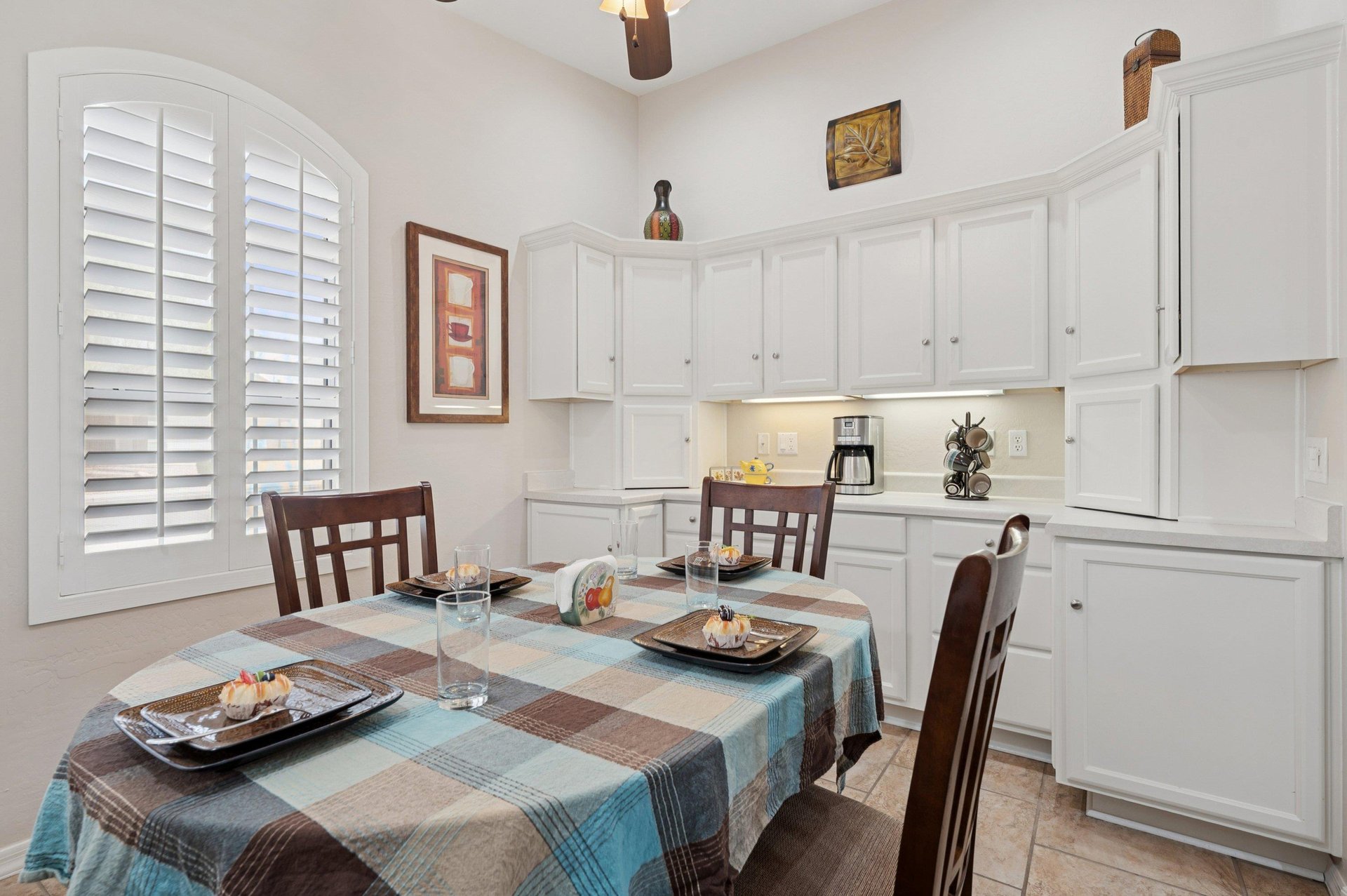 Inviting dining room with seating for four, plenty of storage