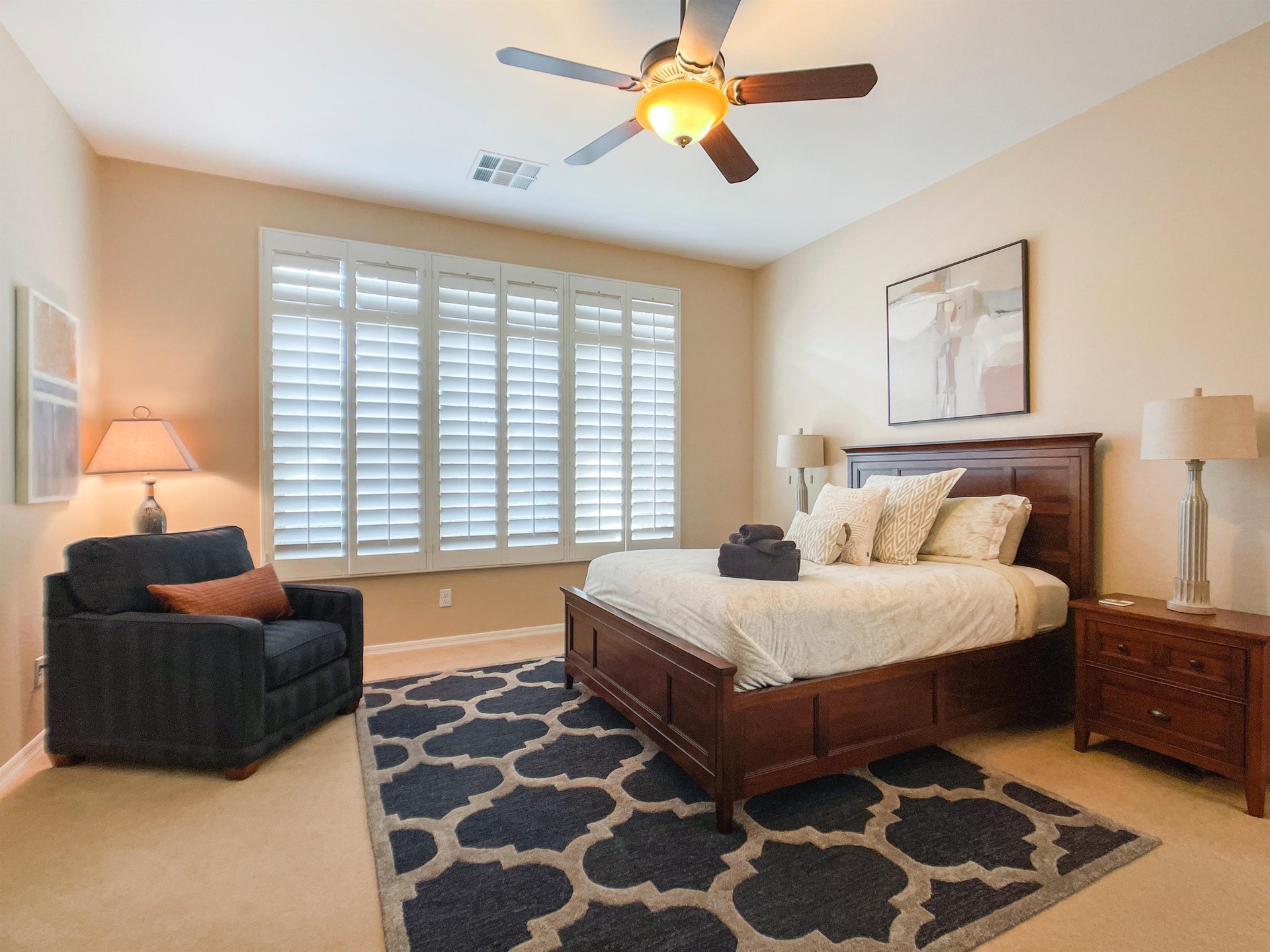 Main Suite with patio access and ensuite bathroom.