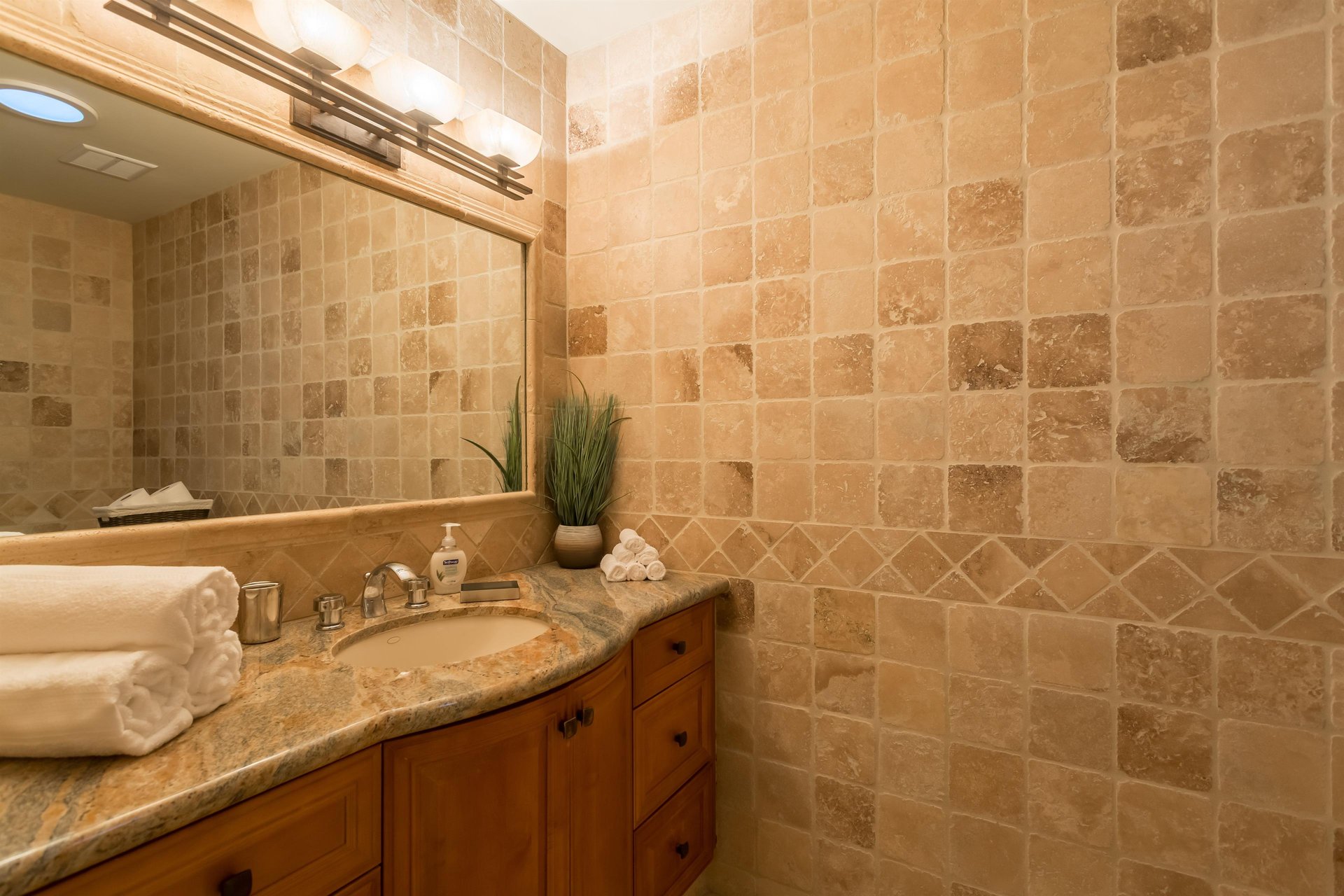Tranquil guest bathroom with a sky light to bring in more natural light