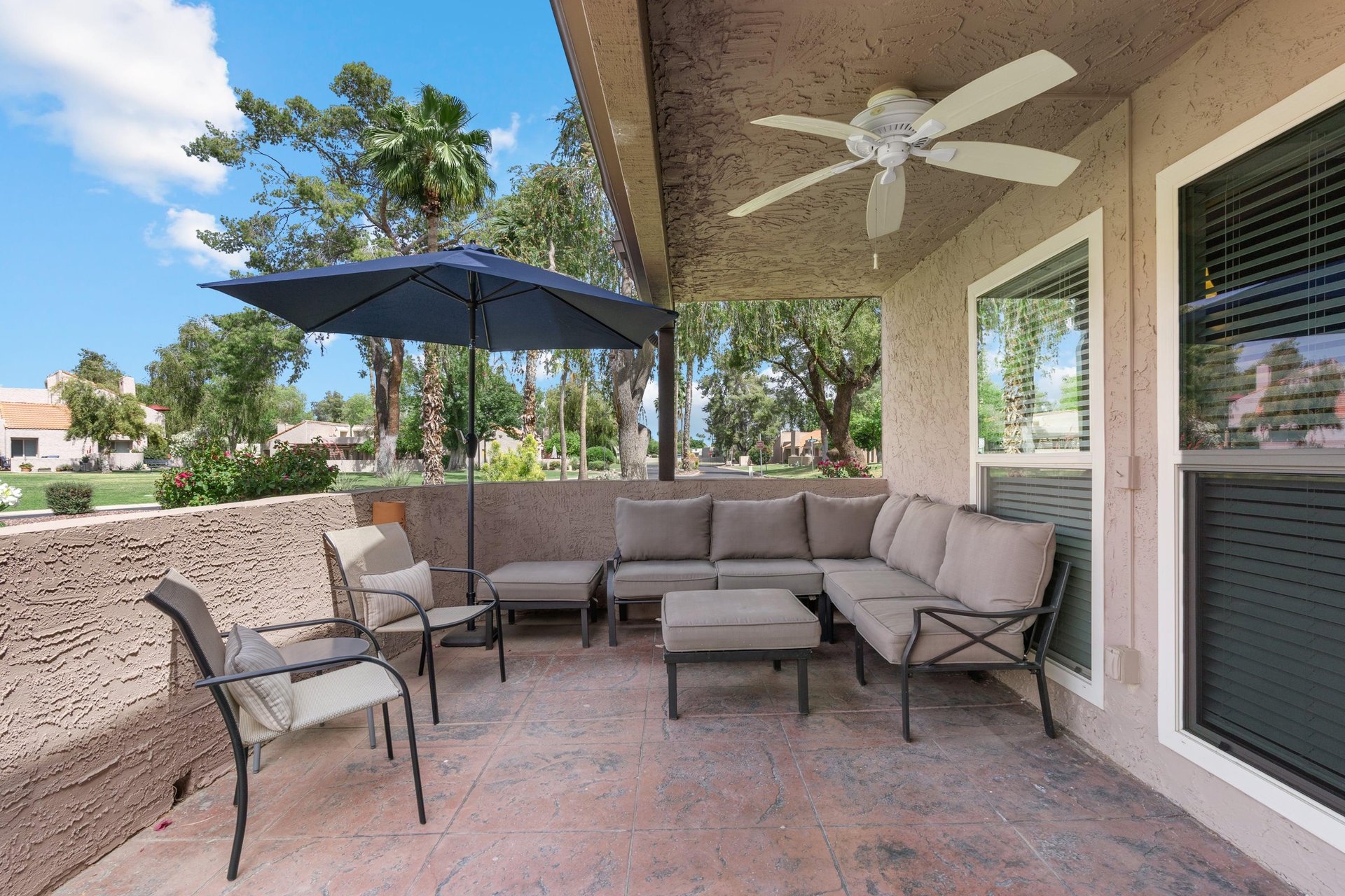 Comfy lounge area to enjoy the Arizona weather, the ceiling fan is a plus