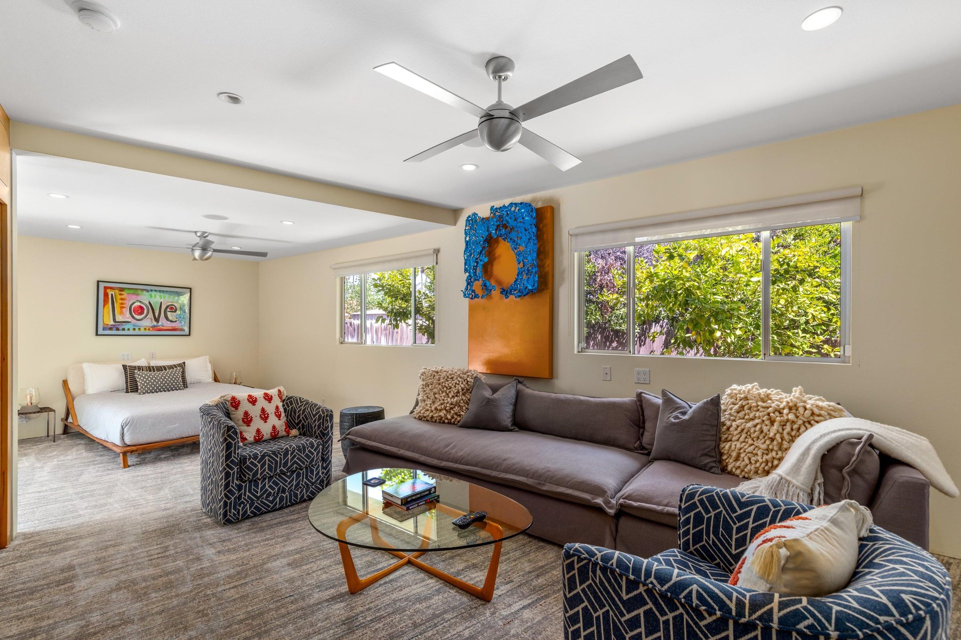 Features a queen size bed, own sitting area, smart TV, patio access, and ensuite bathroom.