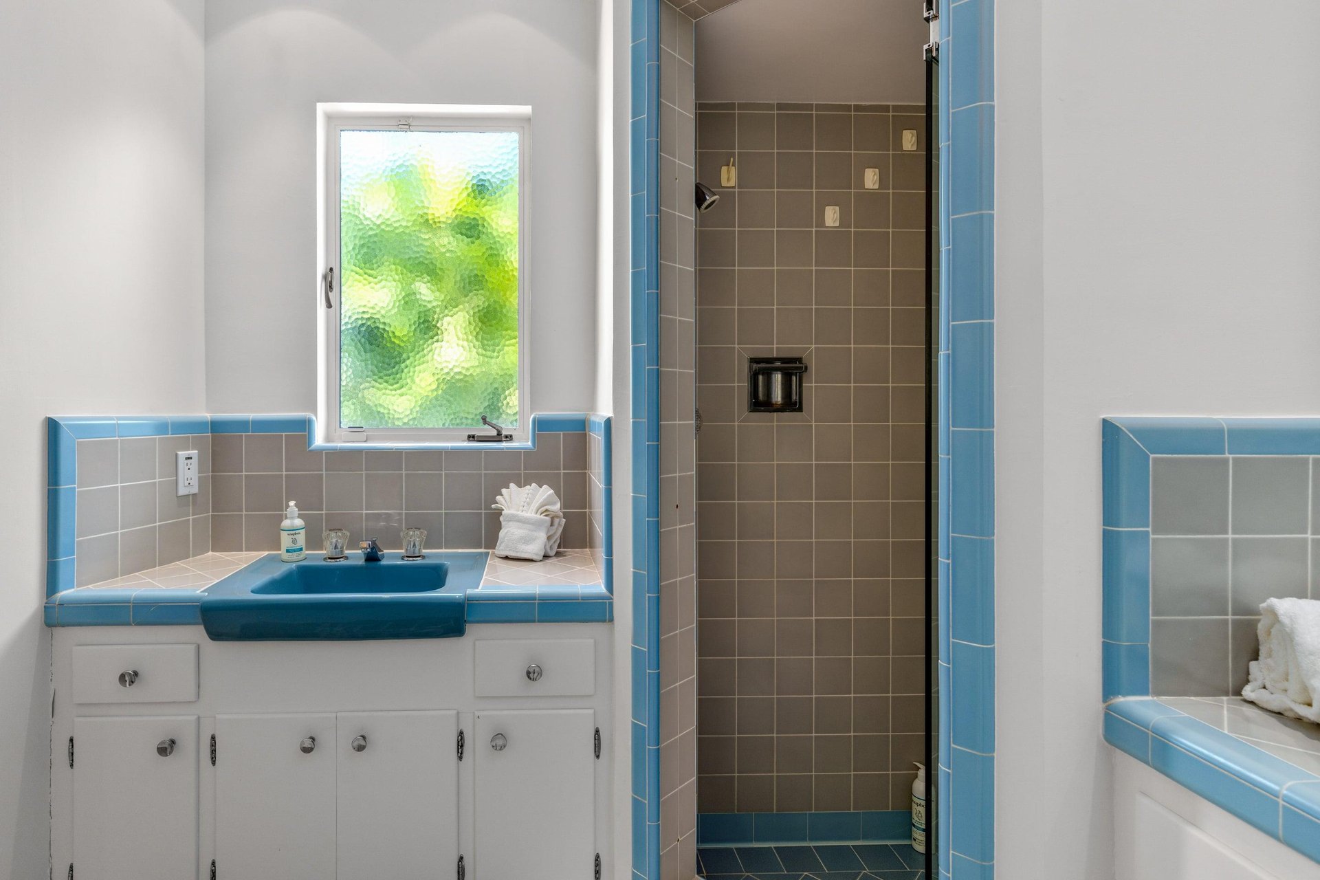 Ensuite bathroom with dual vanity sinks and a standalone shower.