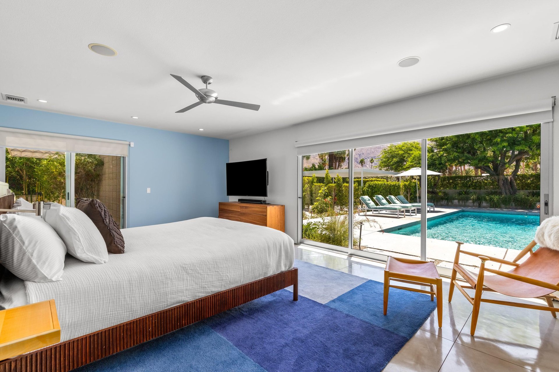 Features a king size bed, large sliding doors to poolspa and patio, ensuite bathroom, and smart TV.