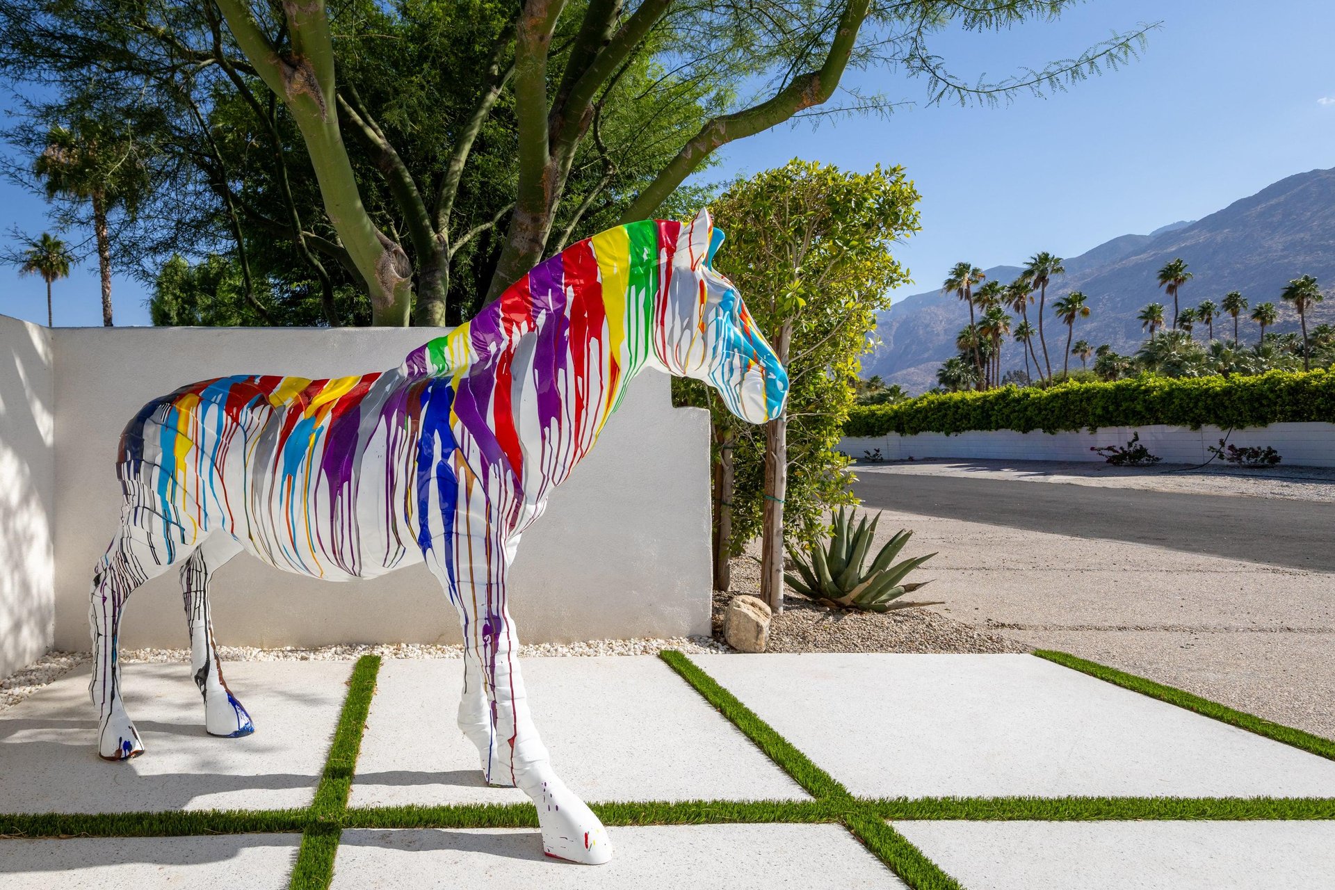 Colorful zebra sculpture near front gate ready to welcome guests.