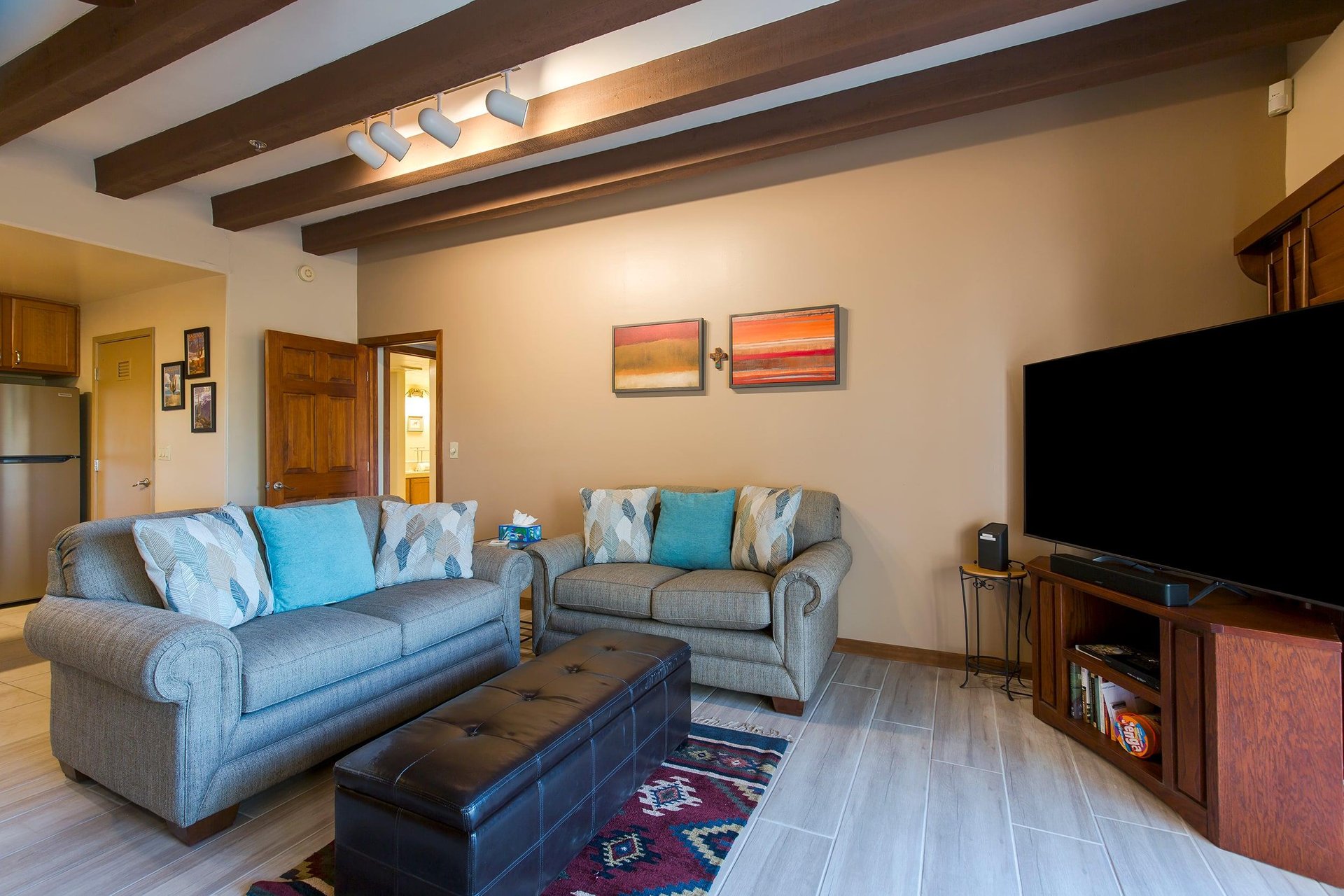 Features a smart TV, woodburning fireplace, and access to the patio.