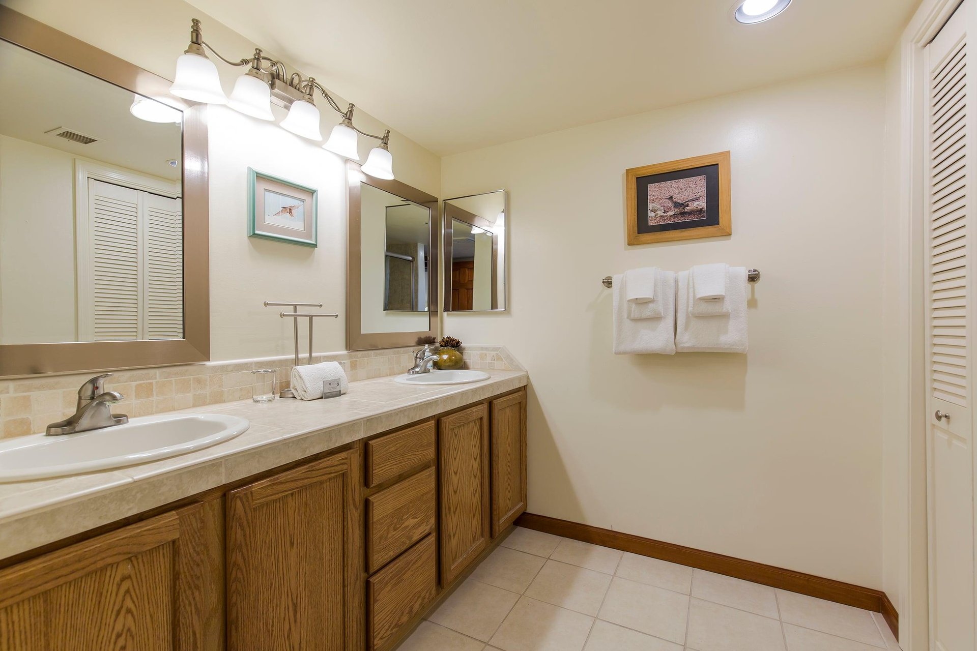 Dual vanity sink, stand alone shower, and plenty of cabinet space.