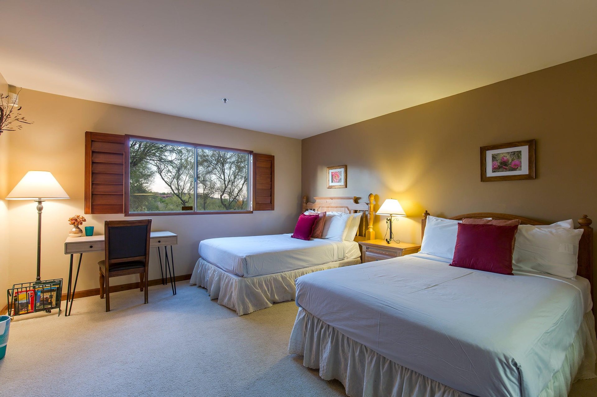 Two full size beds, desk, and kitchenette.