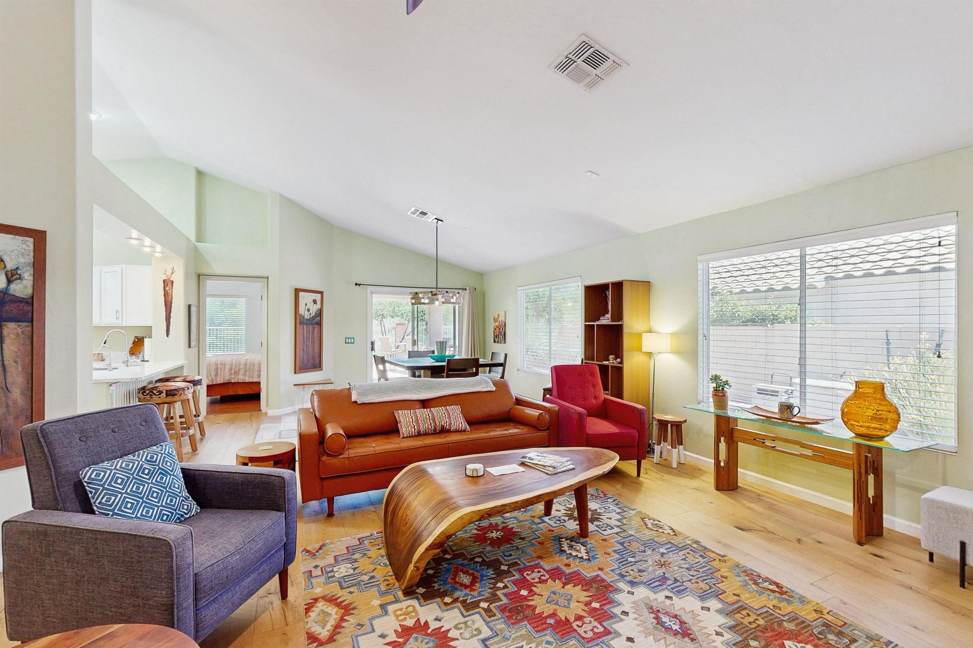 Features vaulted ceilings, plenty of seating, fireplace, and smart TV.