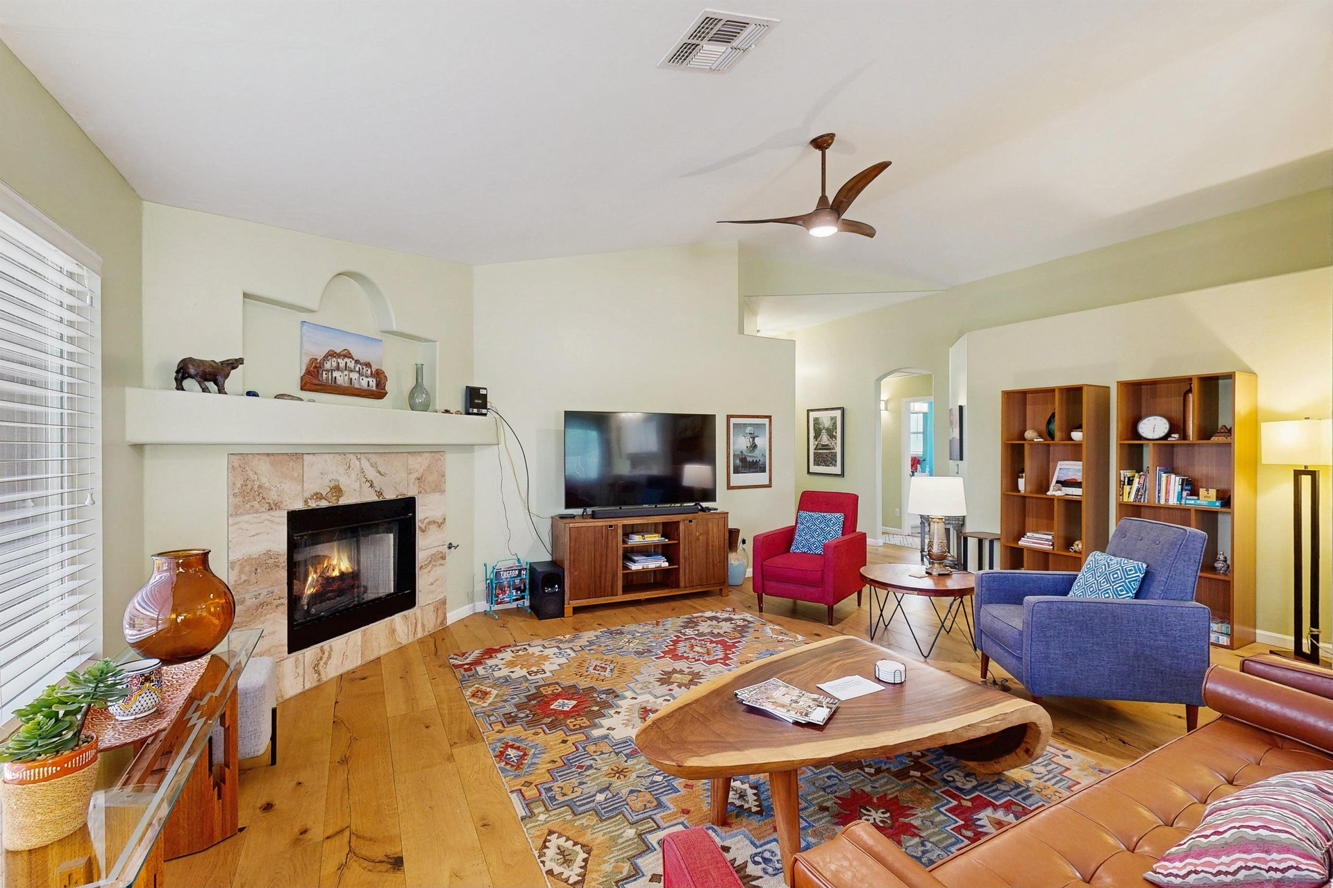 Features vaulted ceilings, plenty of seating, fireplace, and smart TV.