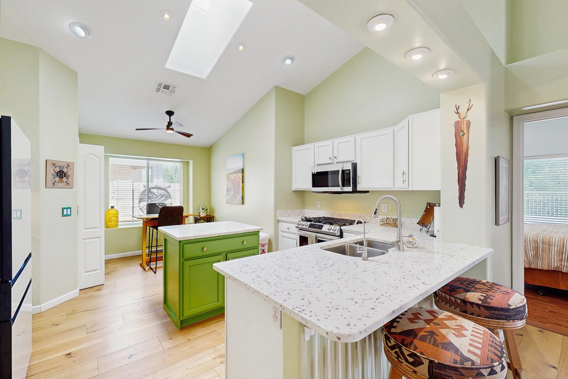 New Samsung white glass front appliances, plenty of counter space, kitchen island, counter seating for 2, and breakfast nook.