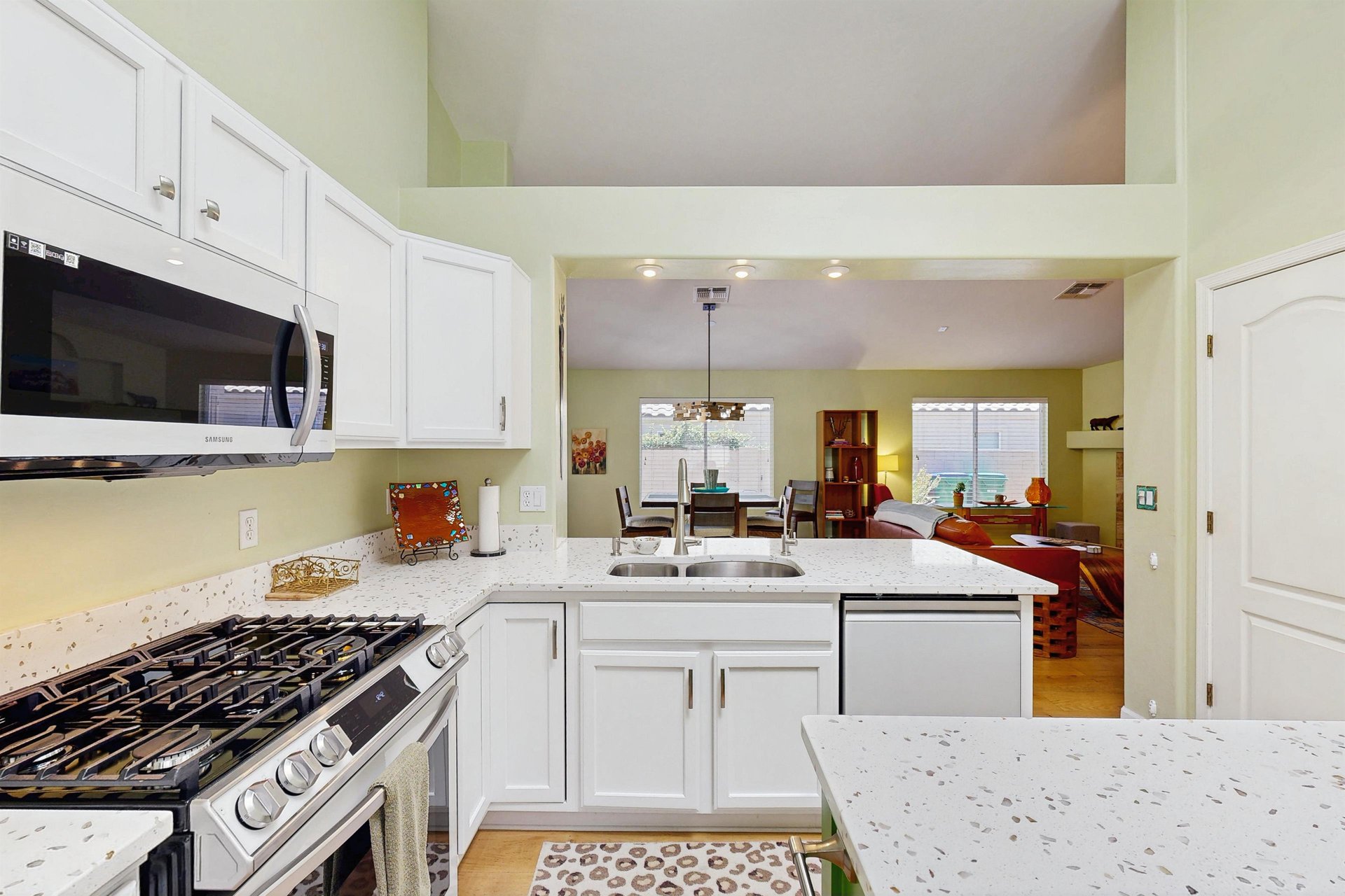 New Samsung white glass front appliances, plenty of counter space, kitchen island, counter seating for 2, and breakfast nook.