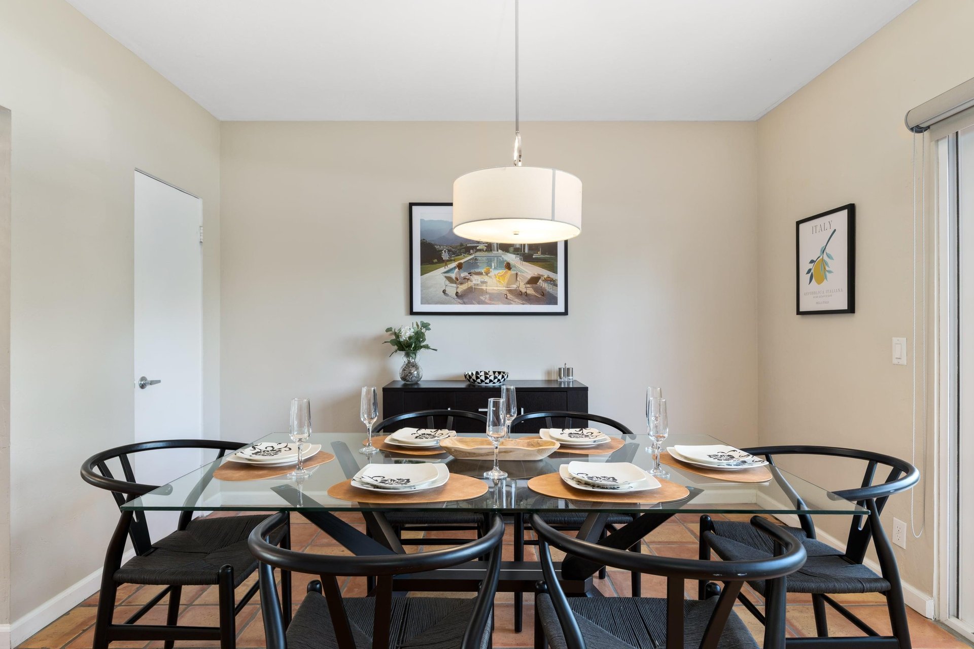 On the other side of the front entry is the dining area with a table that fits up to 6 guests.