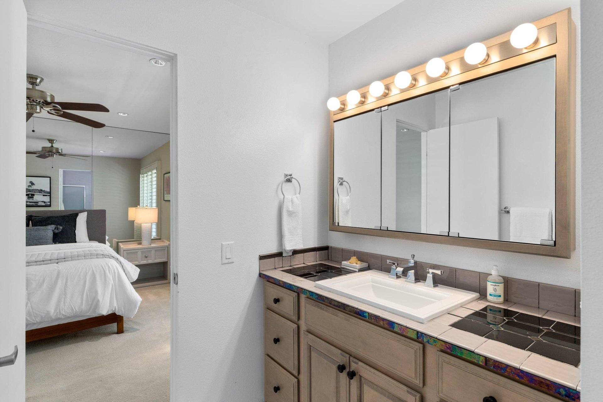 Ensuite bathroom includes stand alone shower with detachable shower head.