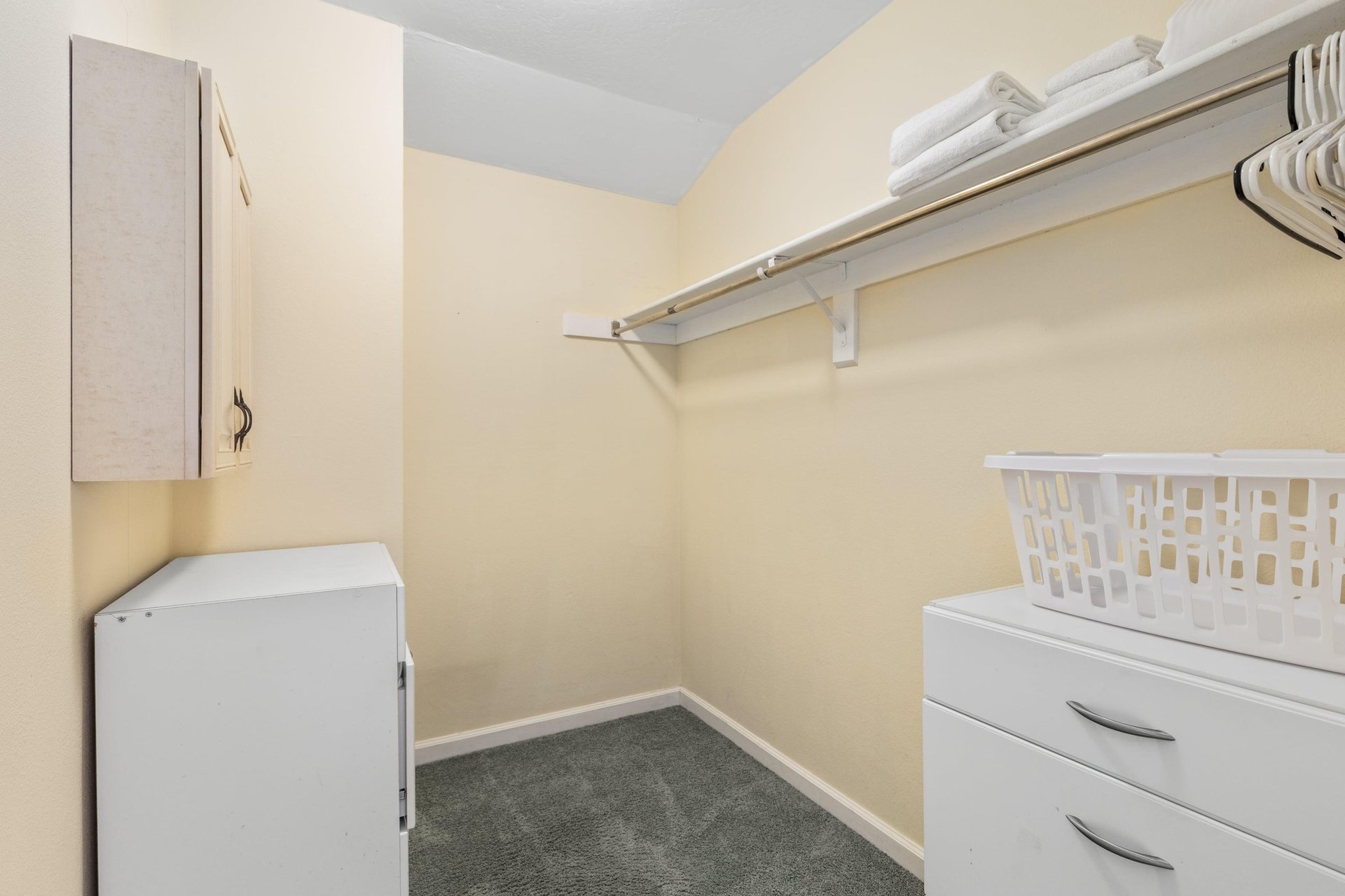 Walkin closet in primary room.