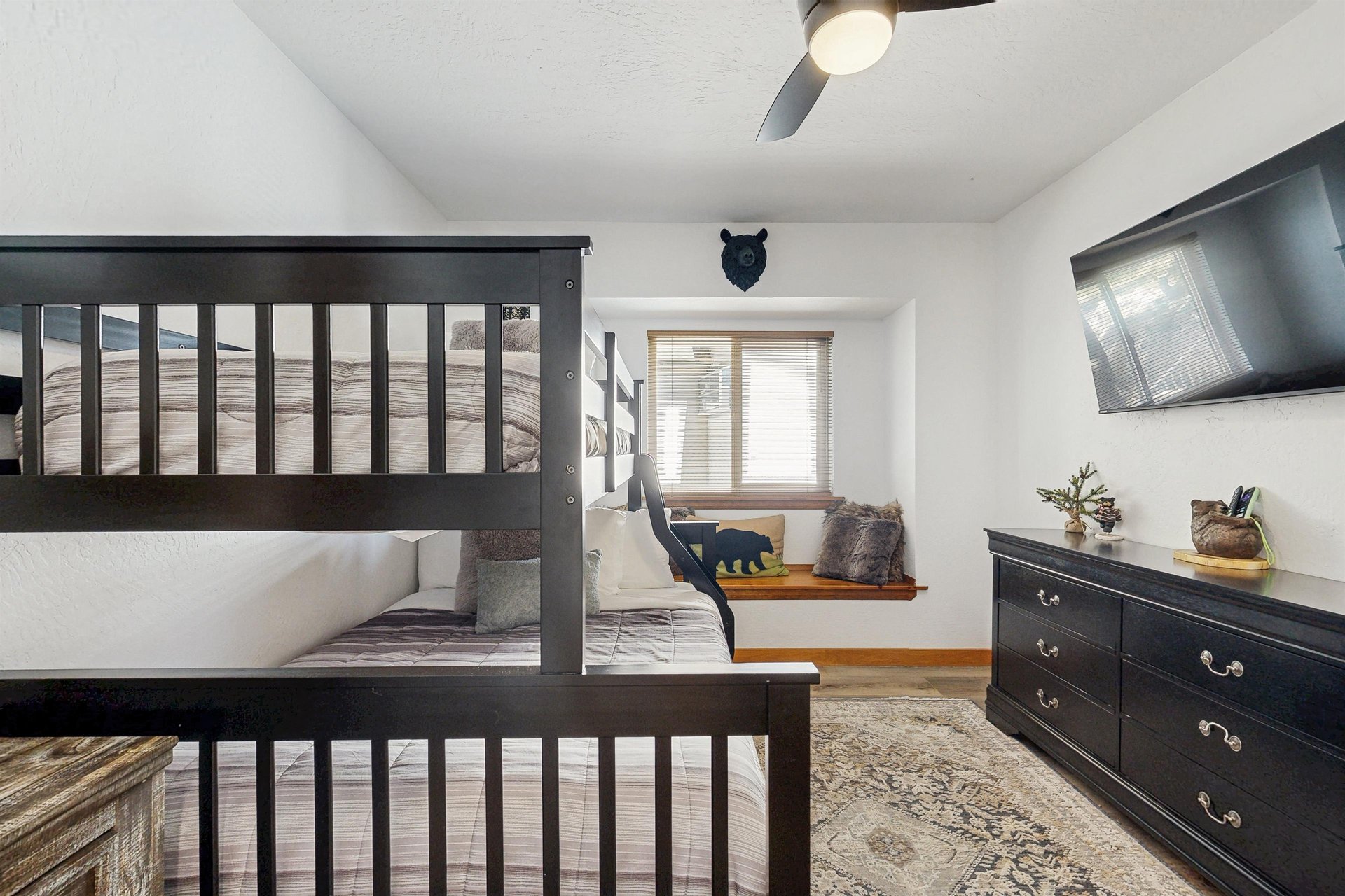 Twin over full bunk beds and smart TV.