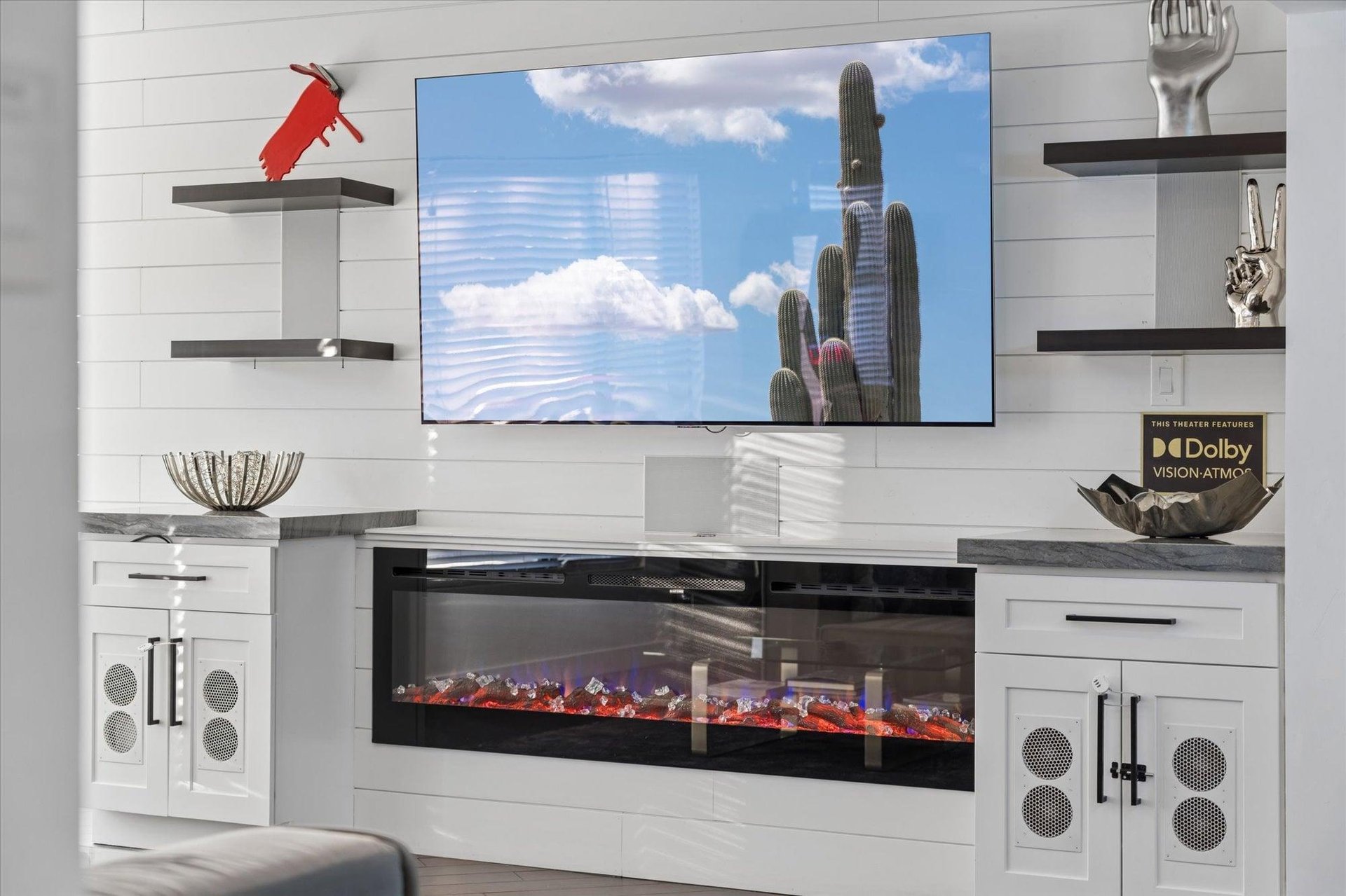 Flatscreen TV and fireplace.