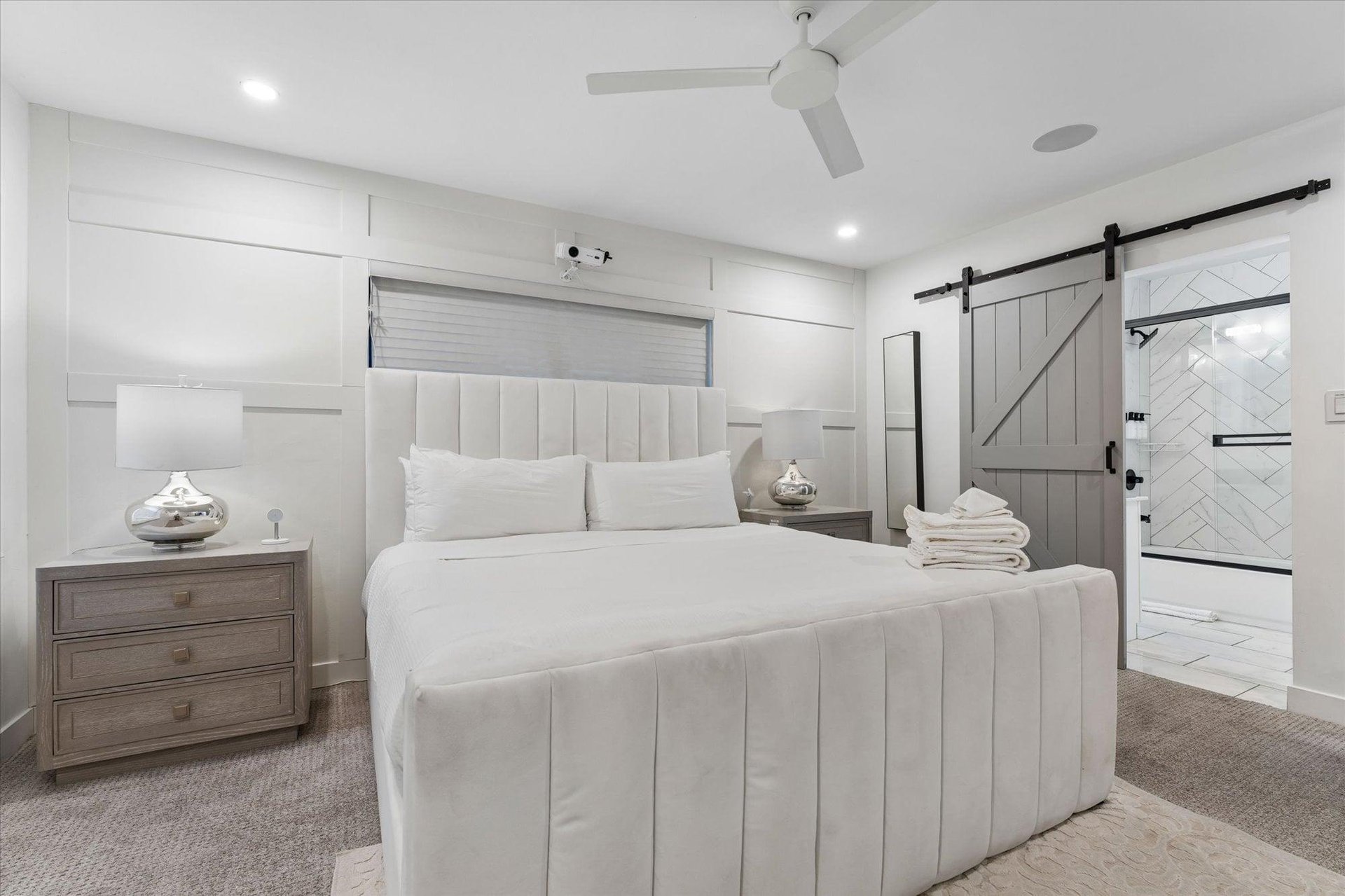 King size bed, projector, and ensuite bathroom.