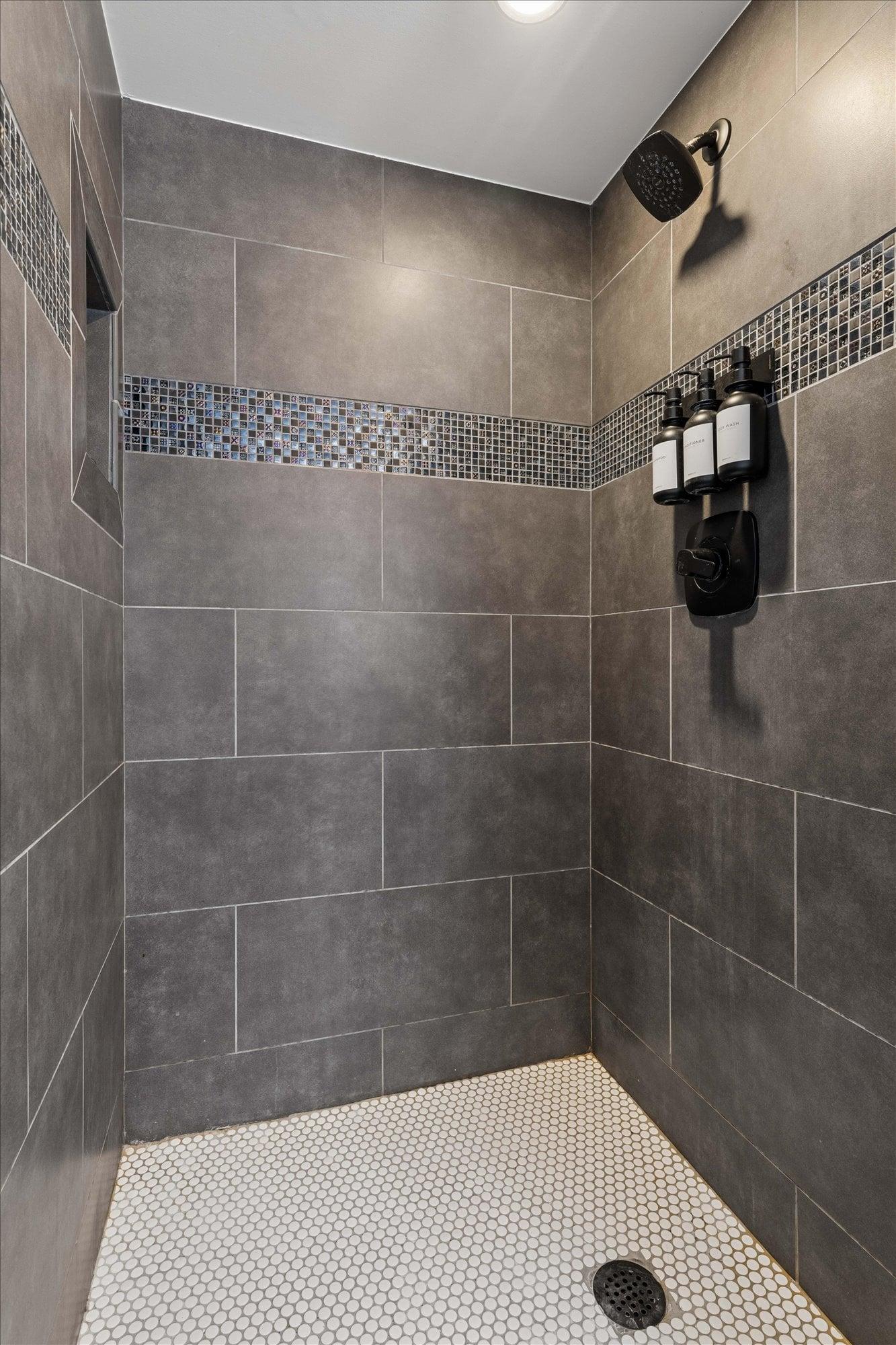 Ensuite bathroom with stand alone shower attached to the officeextra bedroom.