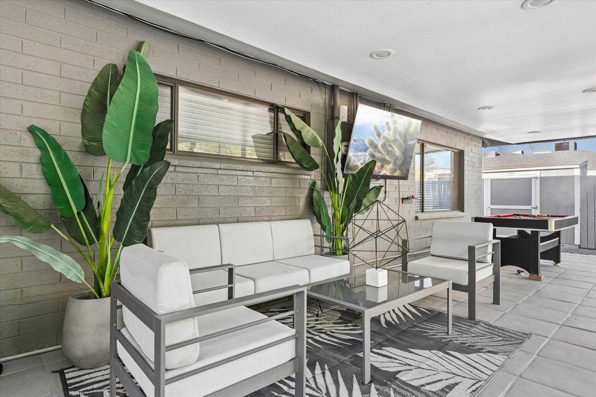 Equipped with outdoor seating, TV, pool table, swinging chairs, misters and speakers.