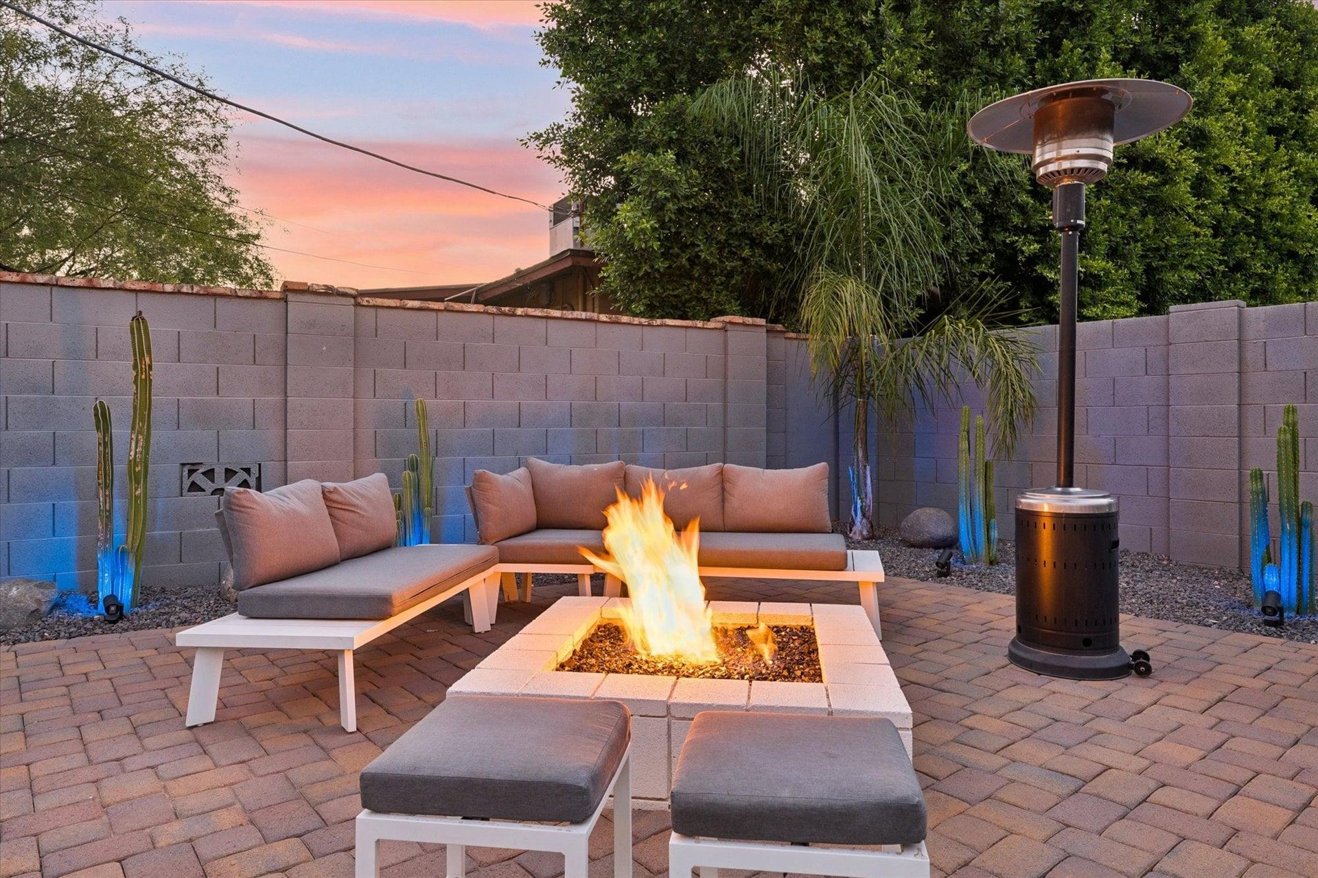 Fire pit with outdoor heater and plenty of seating.