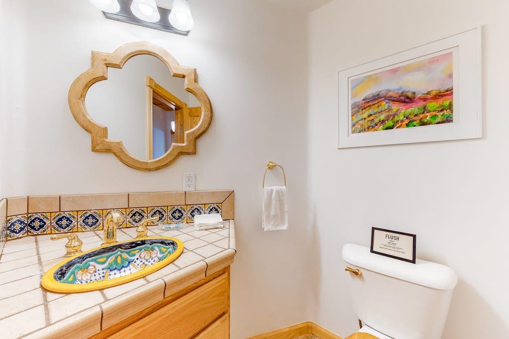 Bathroom next to the living room with beautiful tile accents