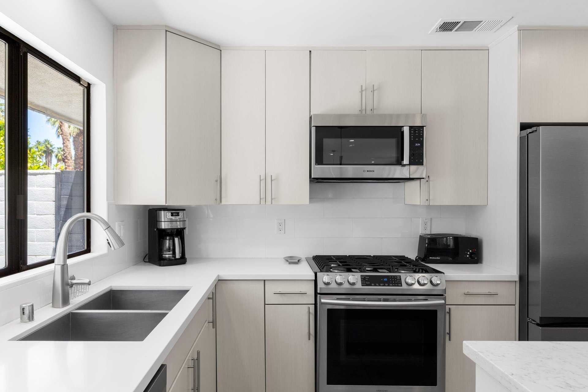 Stainless steel appliances and a coffee maker.