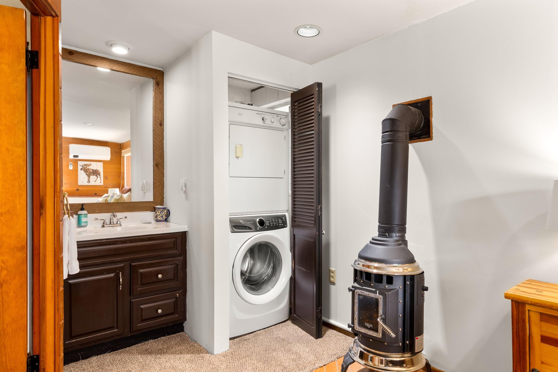 Washer, dryer, and full guest bathroom.