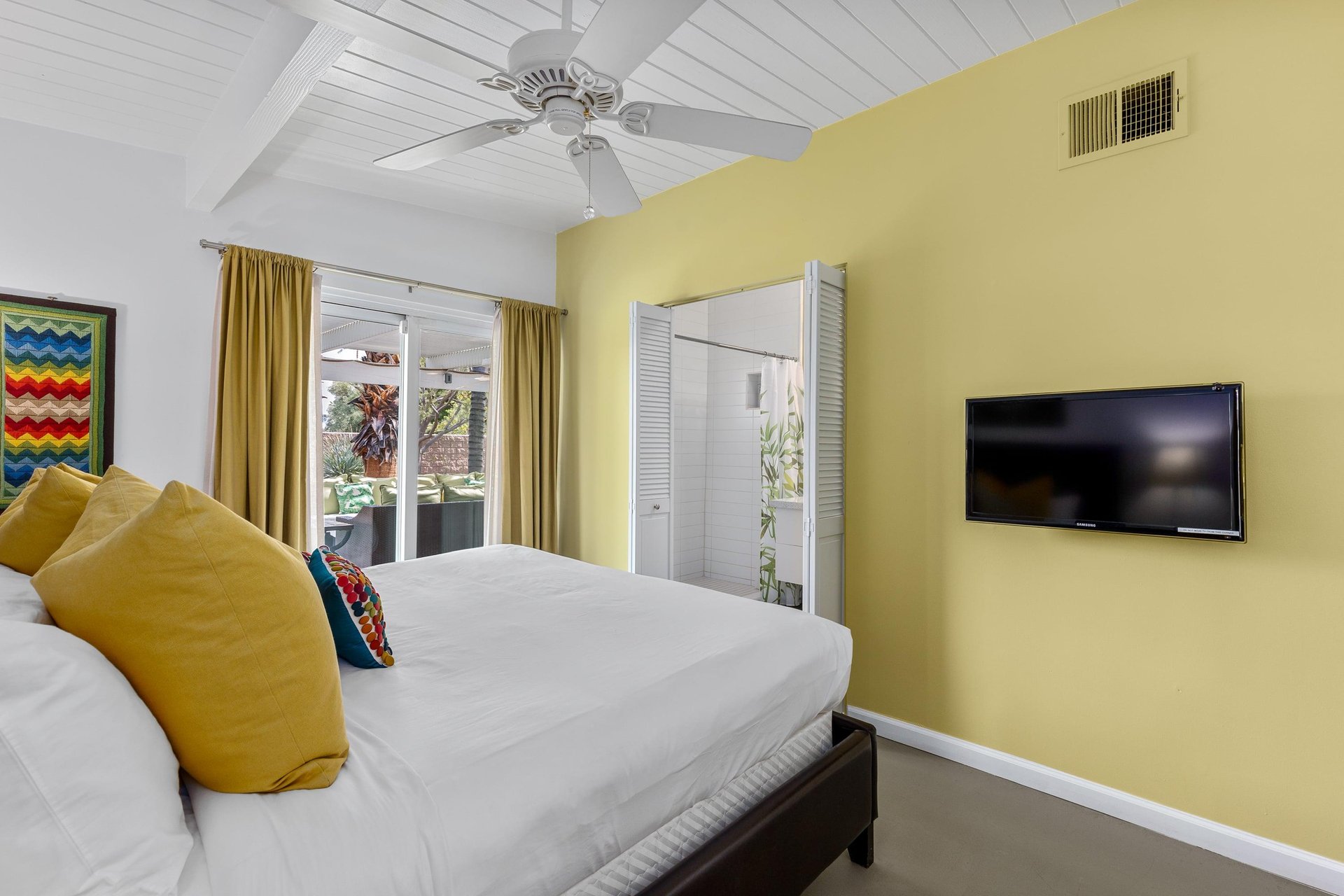 A pop of lemon yellow graces the walls