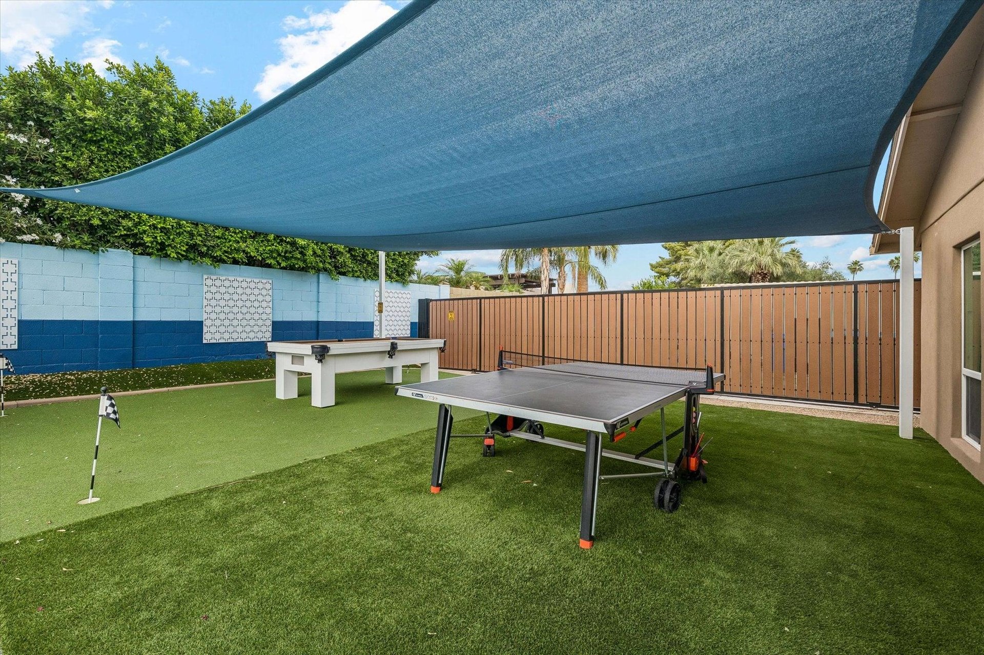 Sunsails, mini golf putting green, and pool table.