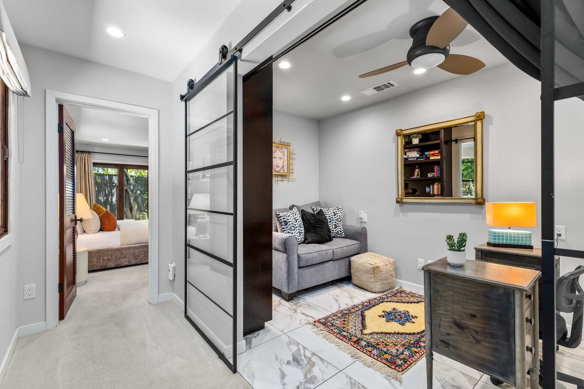 Office with desk and pullout twin sofa bed.
