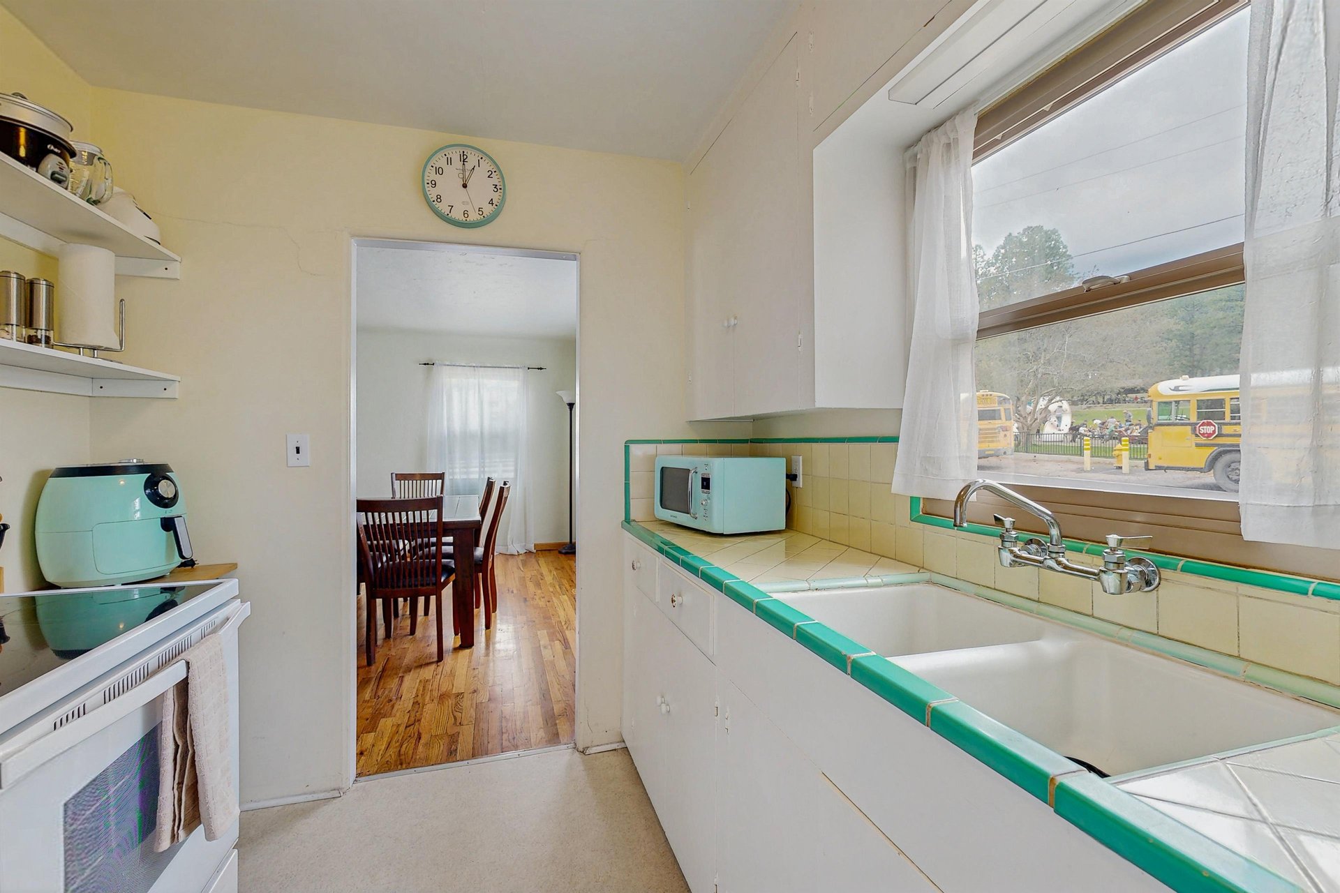 View of kitchen area and dining area.