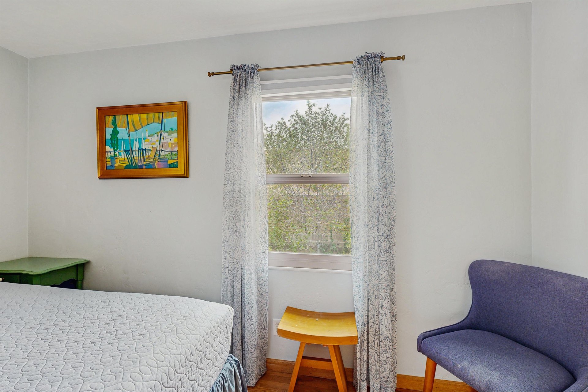 Seating area and bright window that lets in plenty of natural light.