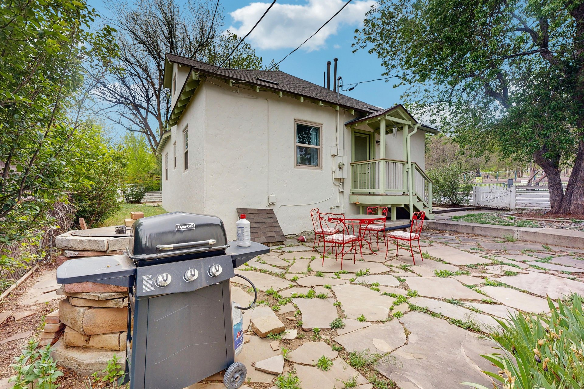 Back patio with outdoor seating and BBQ.