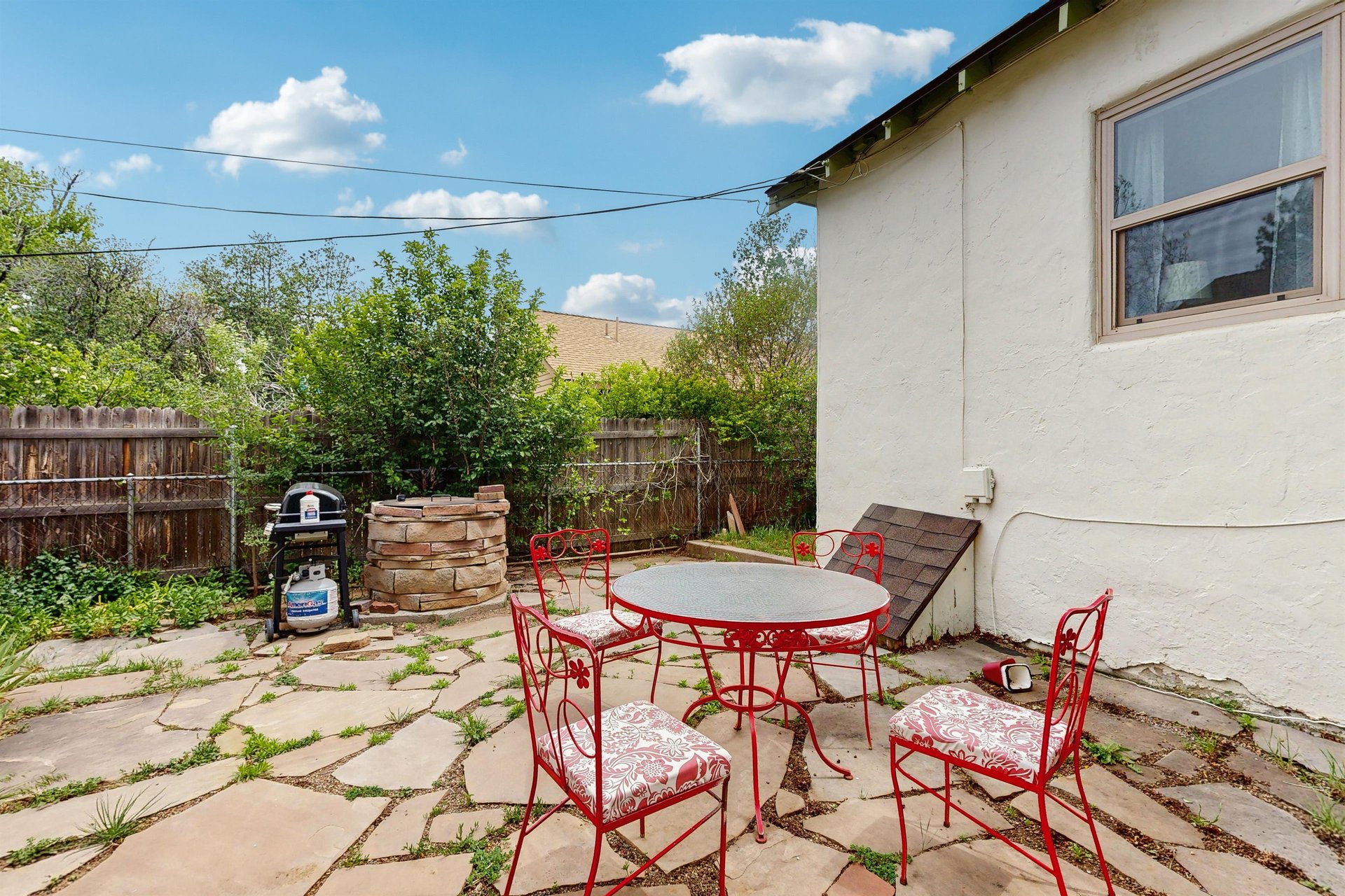 Another view of the back patio and outdoor seating for 4 guests.