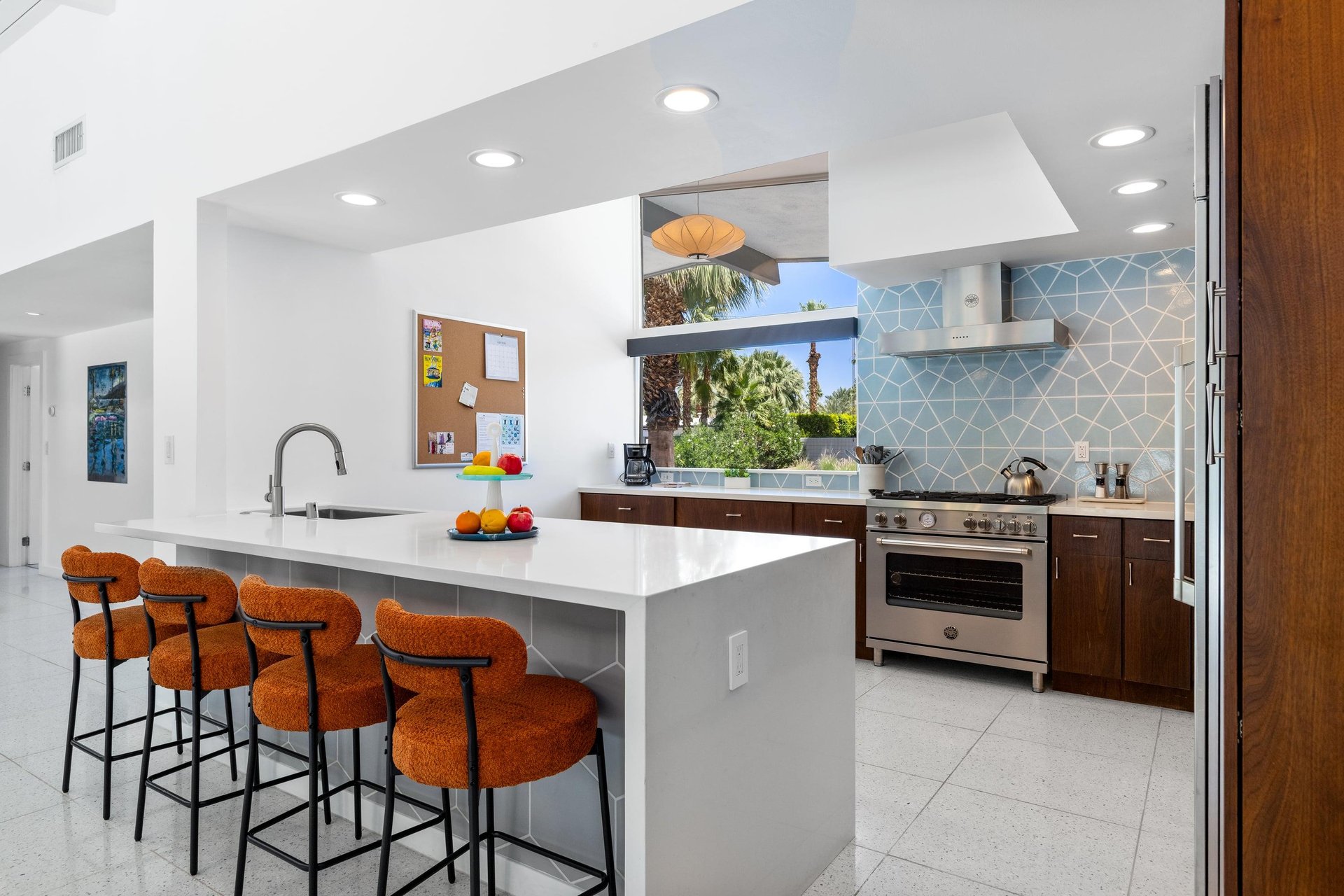 Large island, modern appliances, and large window to bring in more natural lighting.