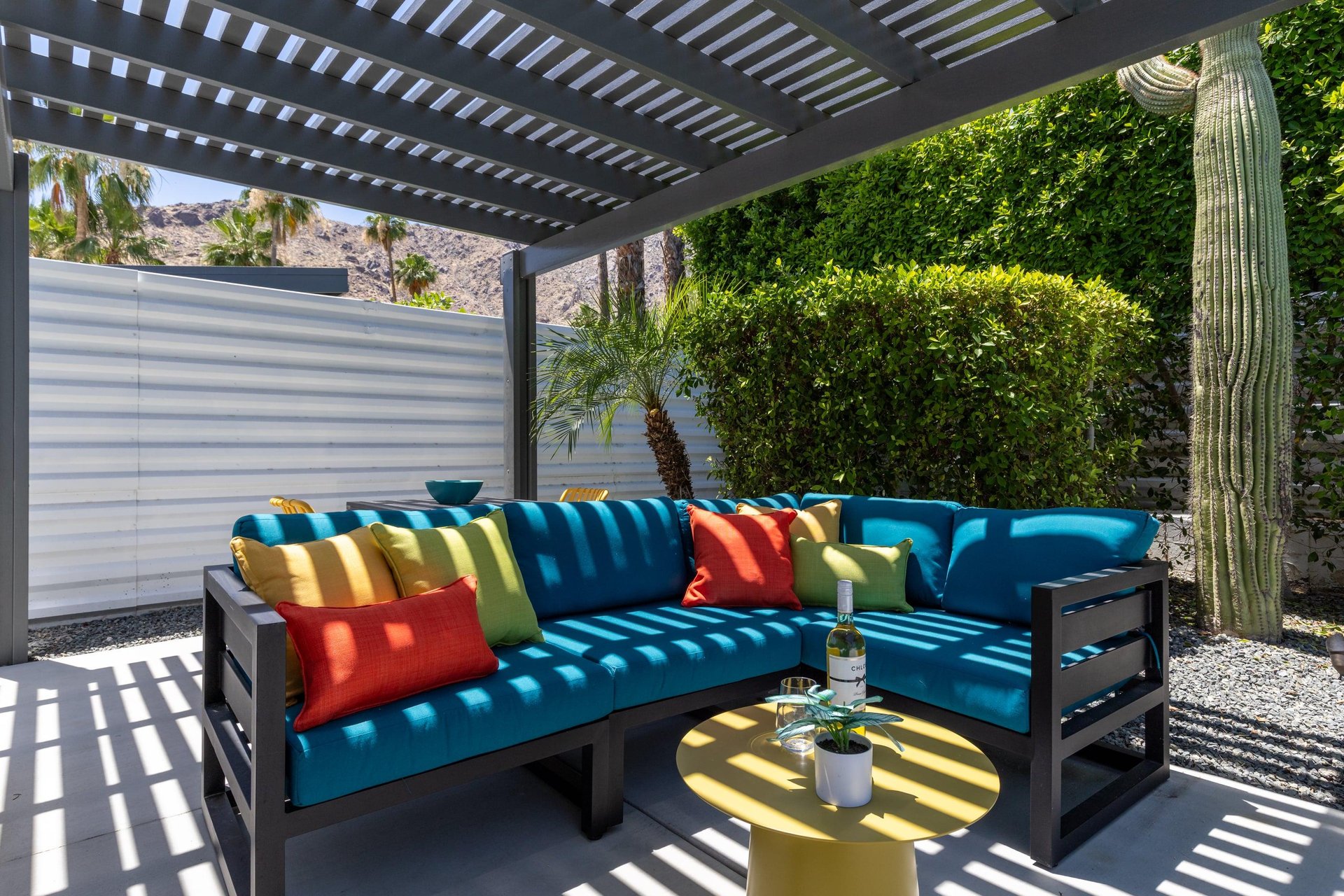 Outdoor seating under pergola.