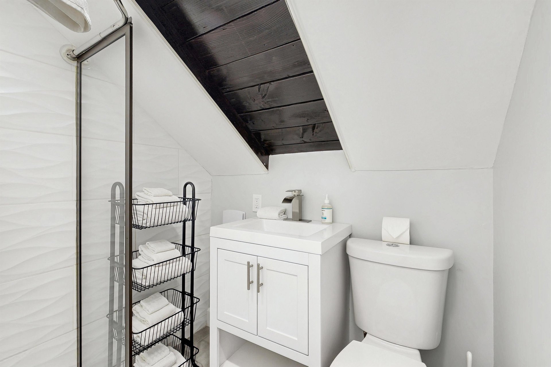 Ensuite primary bathroom with stand alone shower.