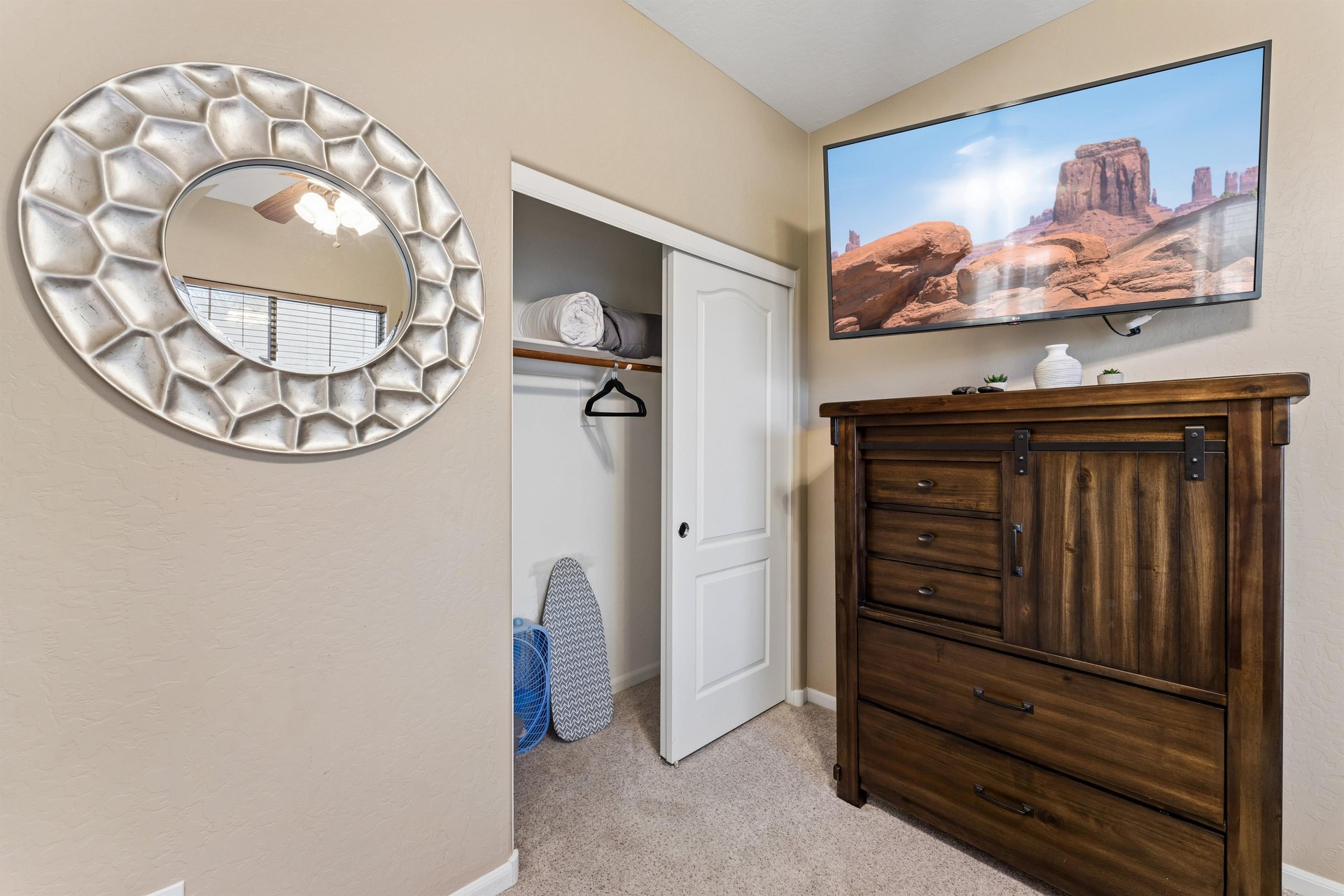 Queen size bed, closet space, and flatscreen TV.