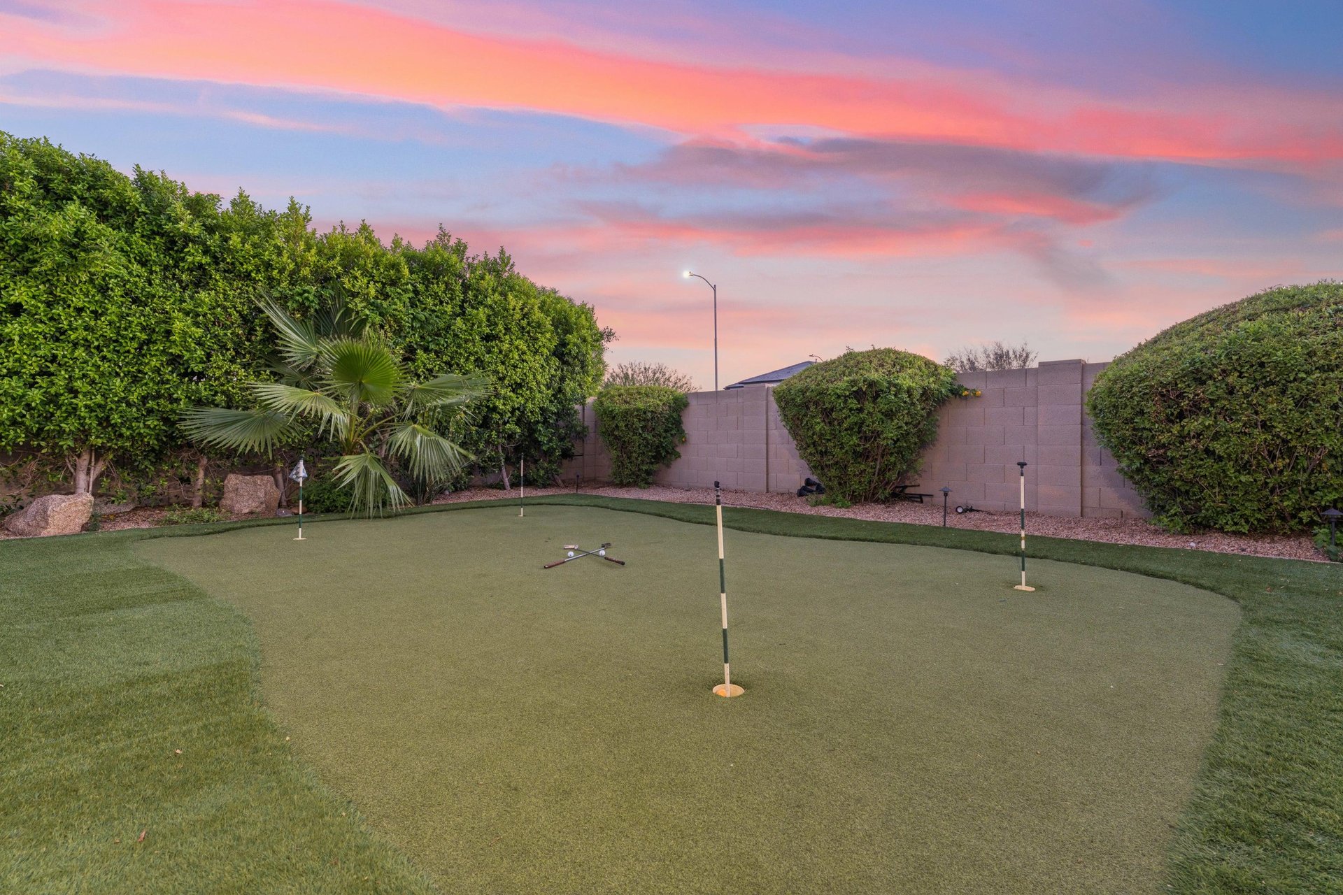 Private putting green next to the firepit.