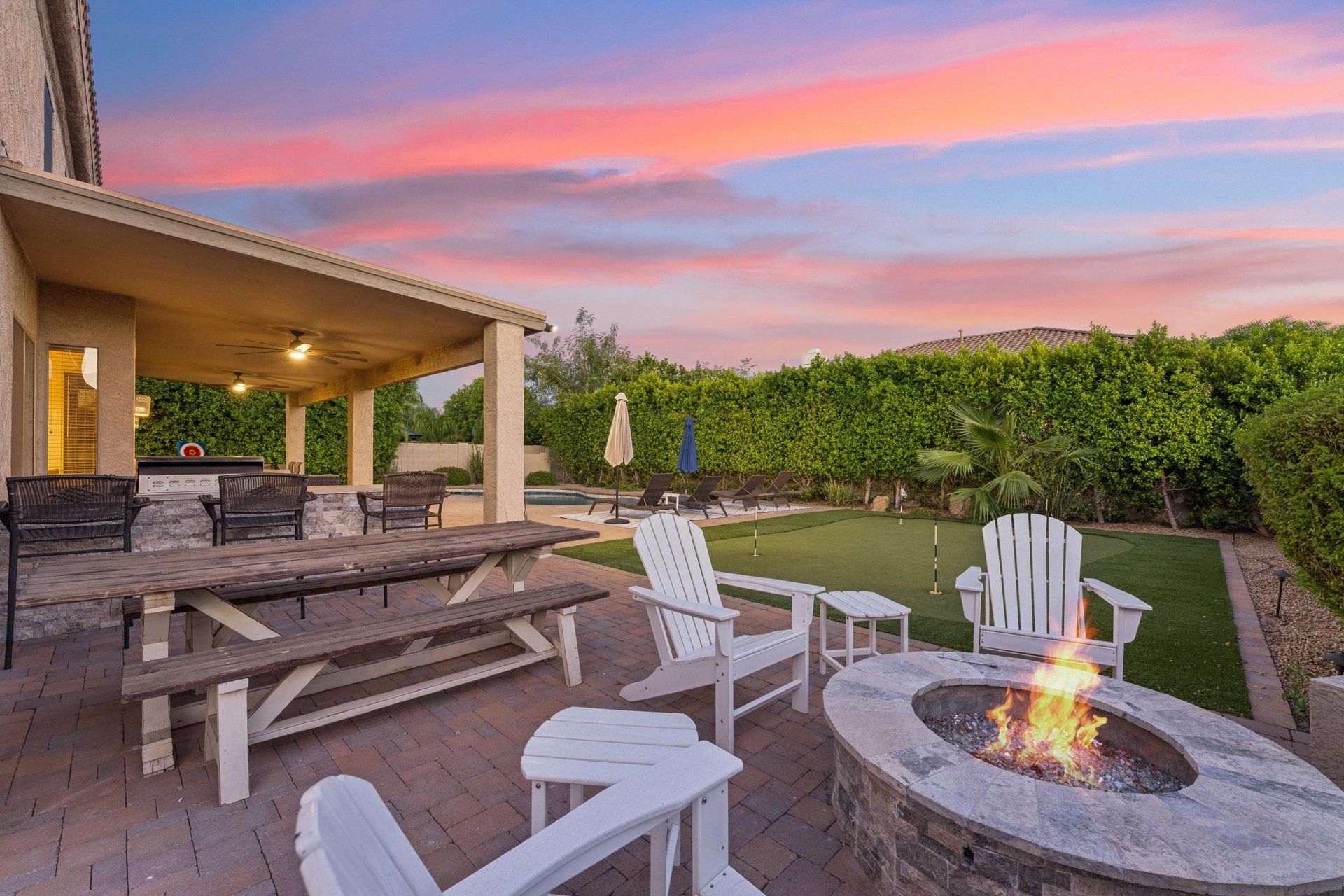 Firepit with plenty of built in seating and additional chairs.