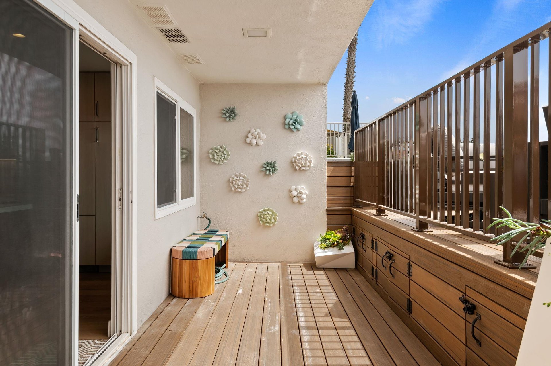 Below the deck, through the sliding glass doors into the kitchen and living area.