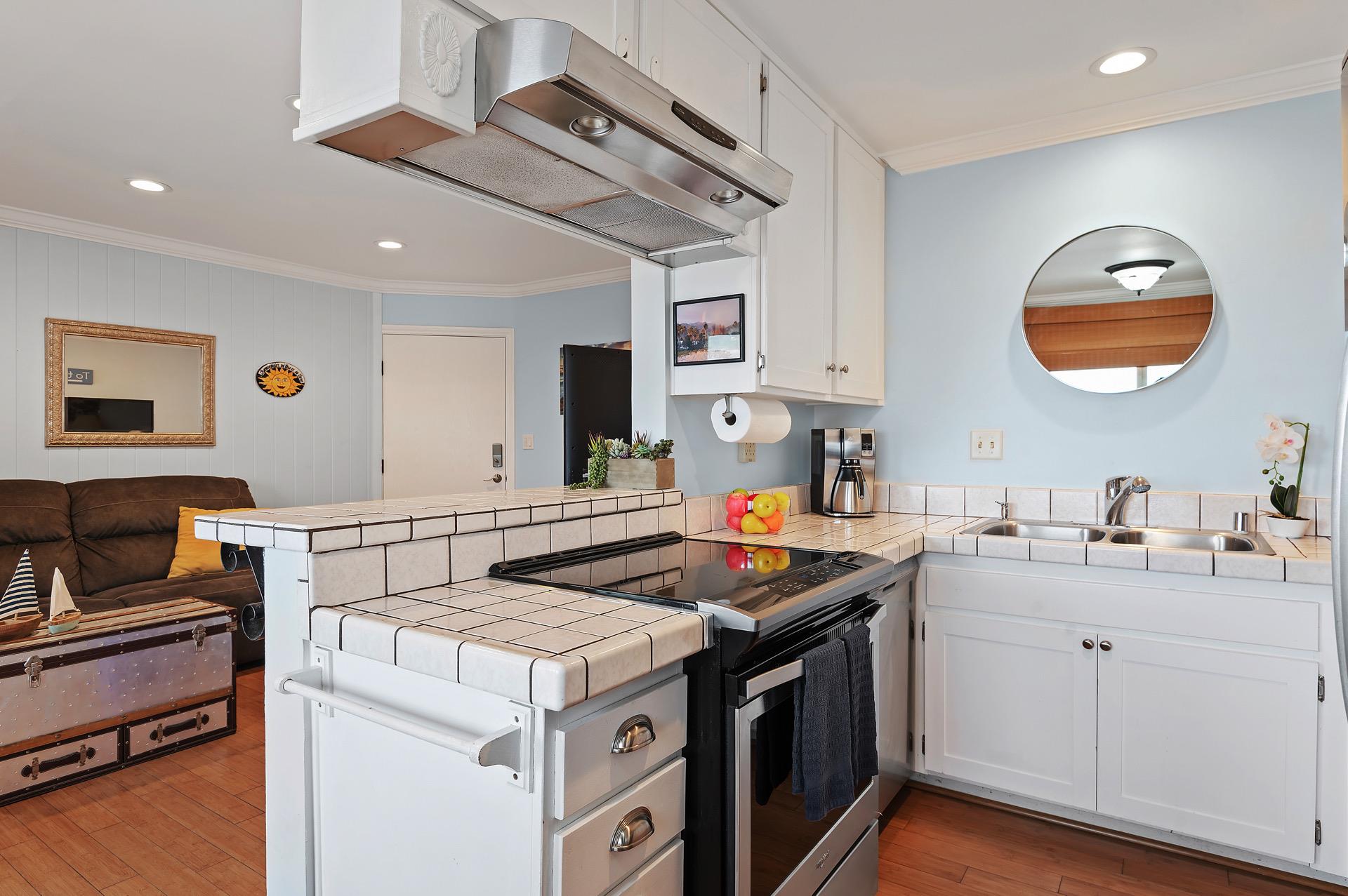 Flat top cook top, dishwasher and oven.
