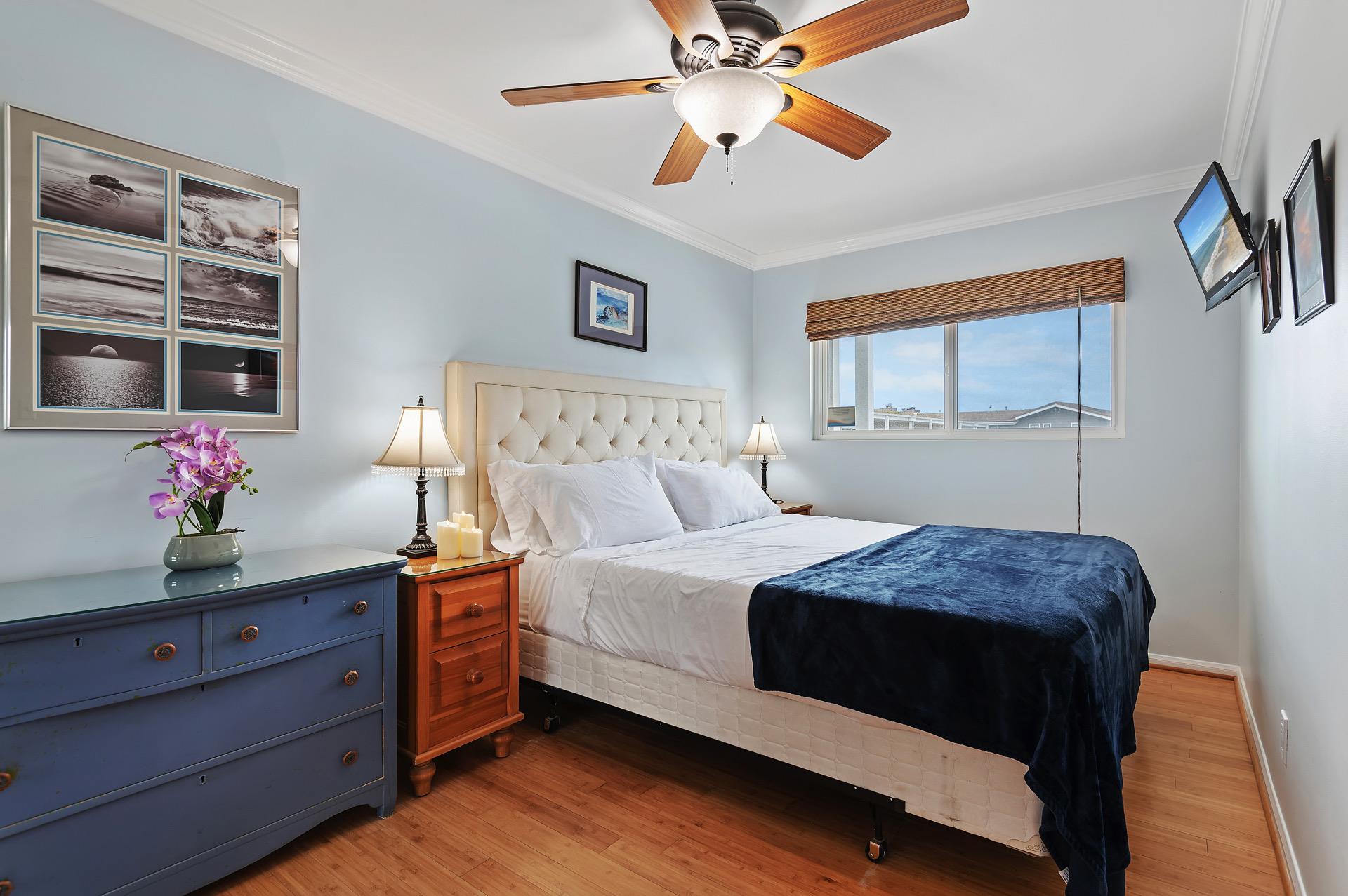 Master bedroom with ceiling fan and California King Bed