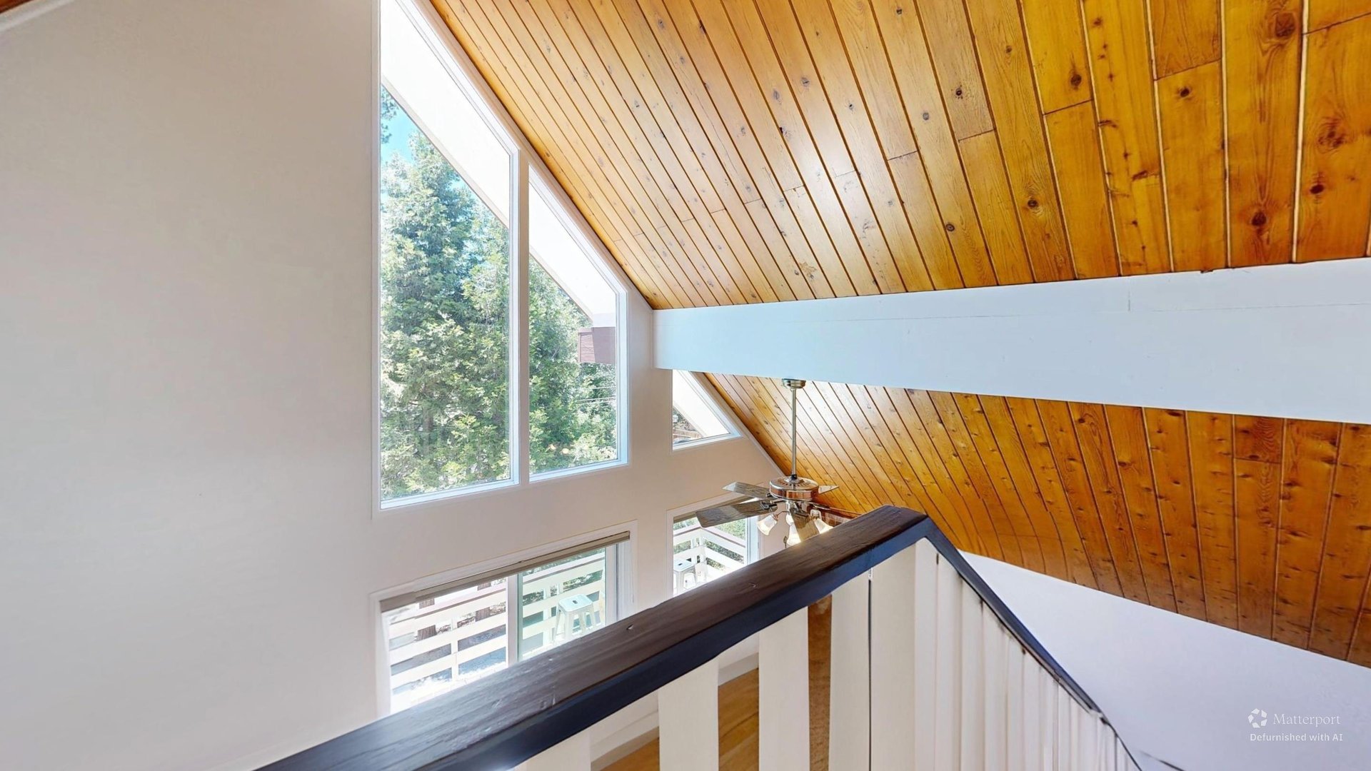 Stairs with beautiful views heading up to the top level of the home.