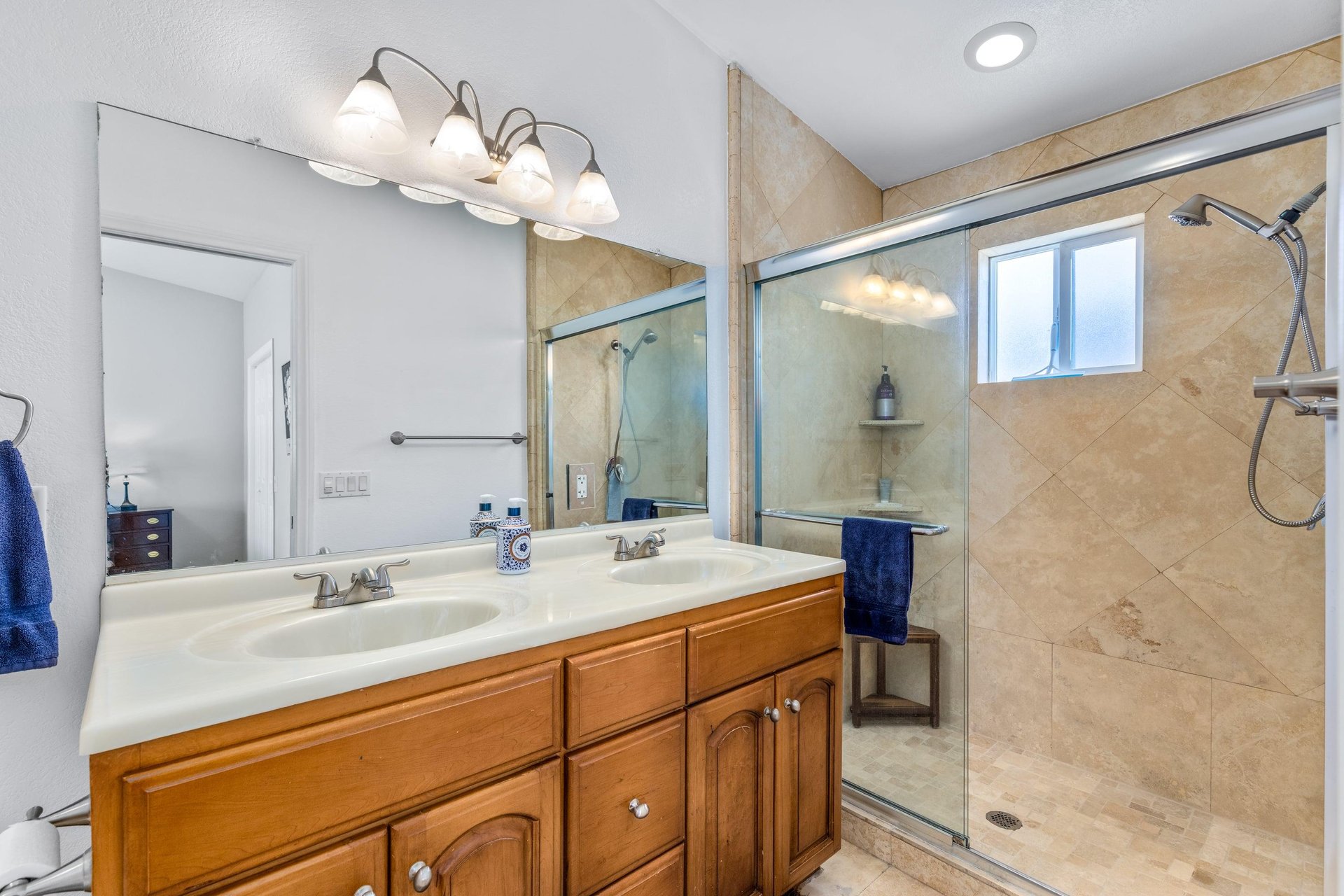 Dual vanity sink, walkin shower, and standalone jet tub.